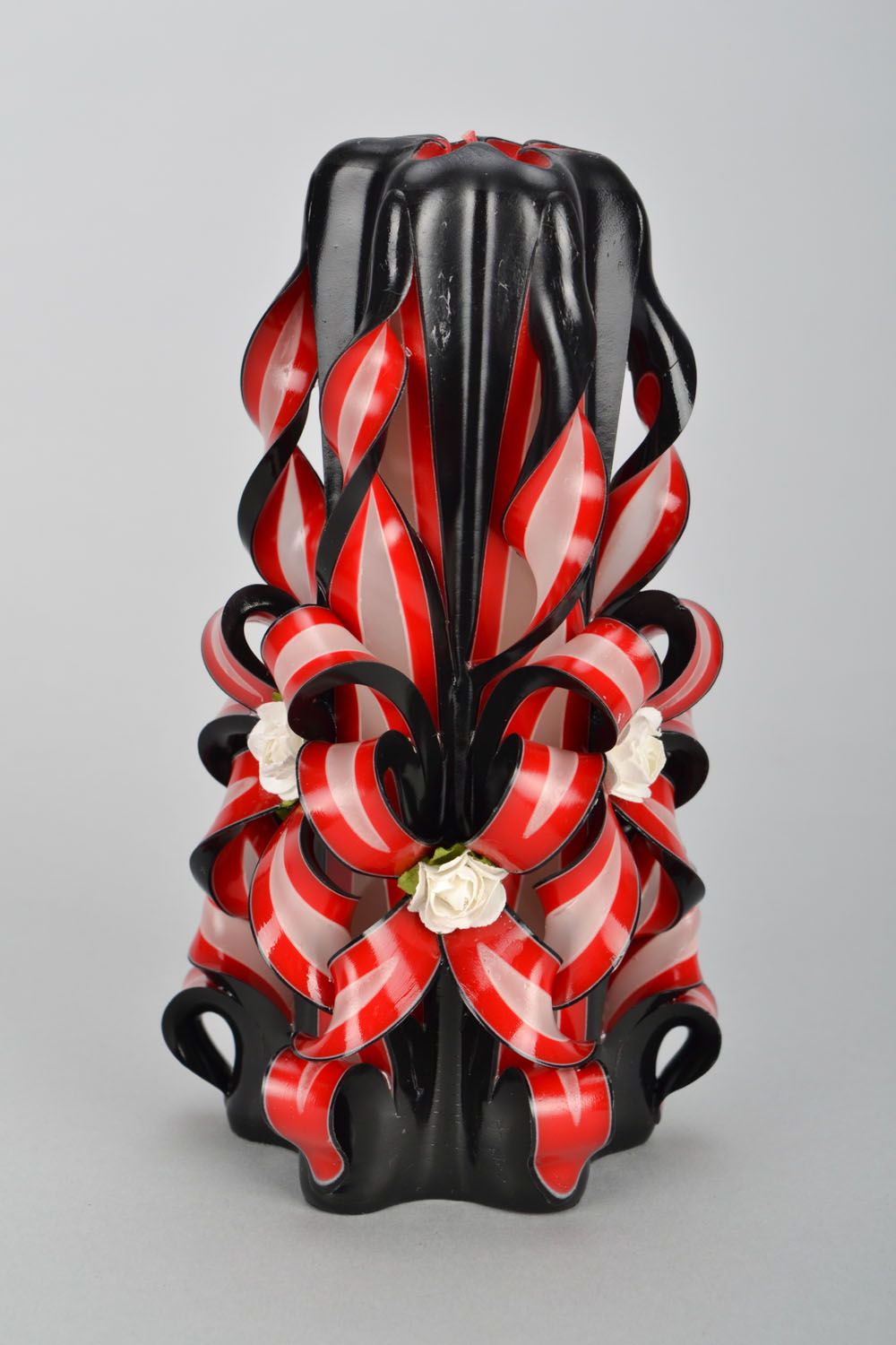 Black and red carved candle photo 3