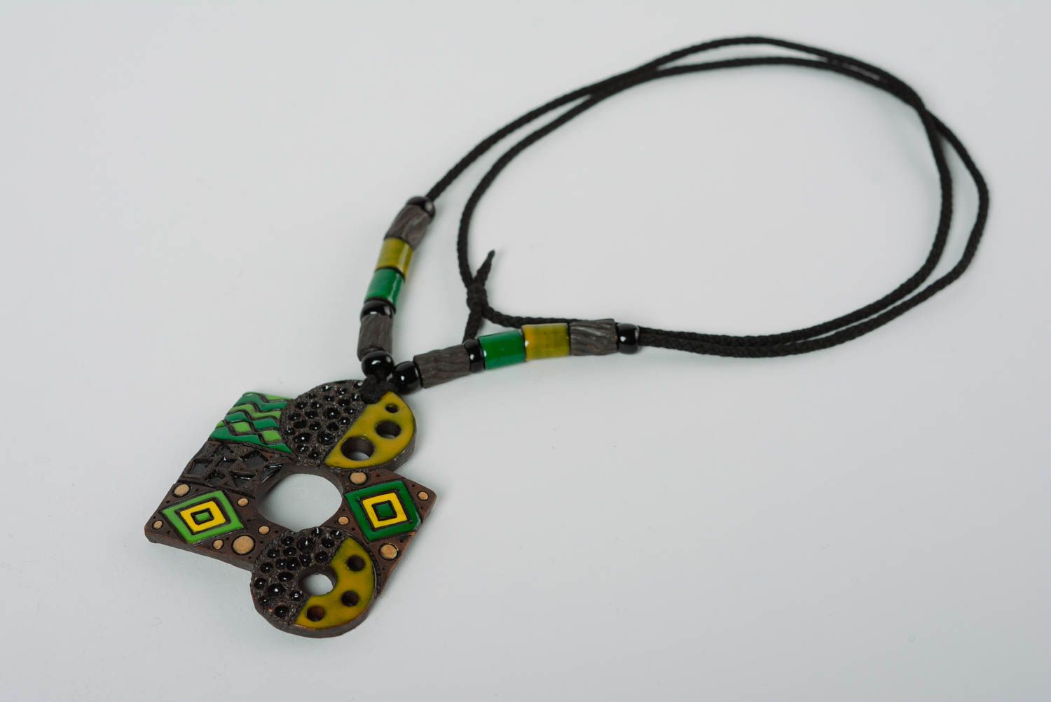 Handmade clay pendant on long cord stylish designer accessory with enamel painting photo 1