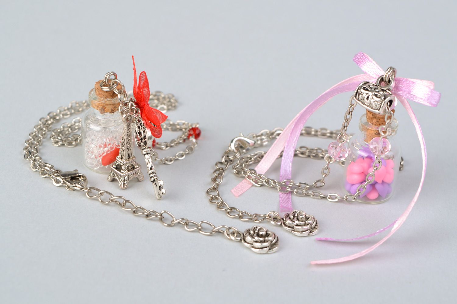 Set of 2 handmade designer glass bottle pendants on long metal chains  photo 1