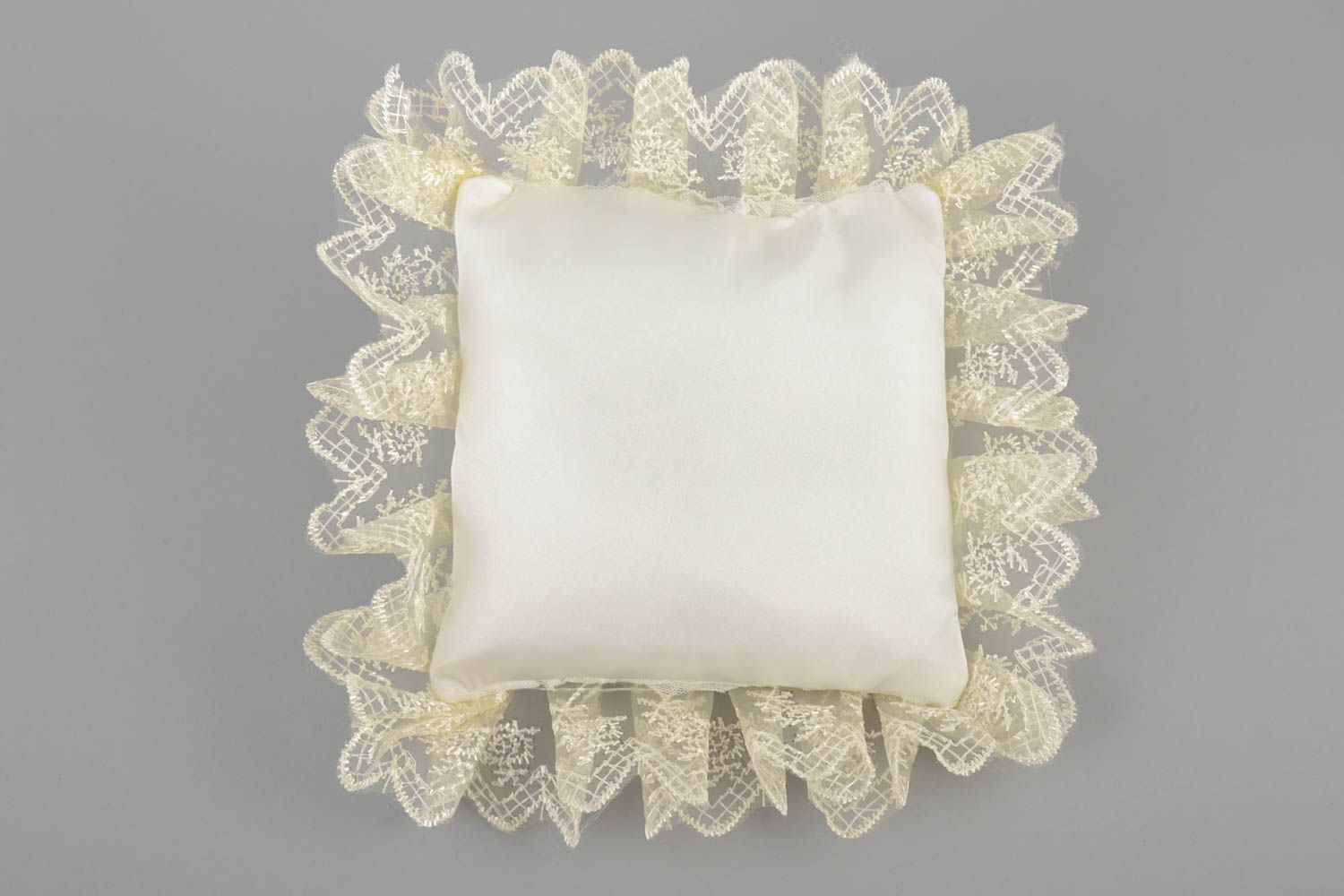 Handmade decorative fabric ring pillow with cream lace and artificial flowers photo 3