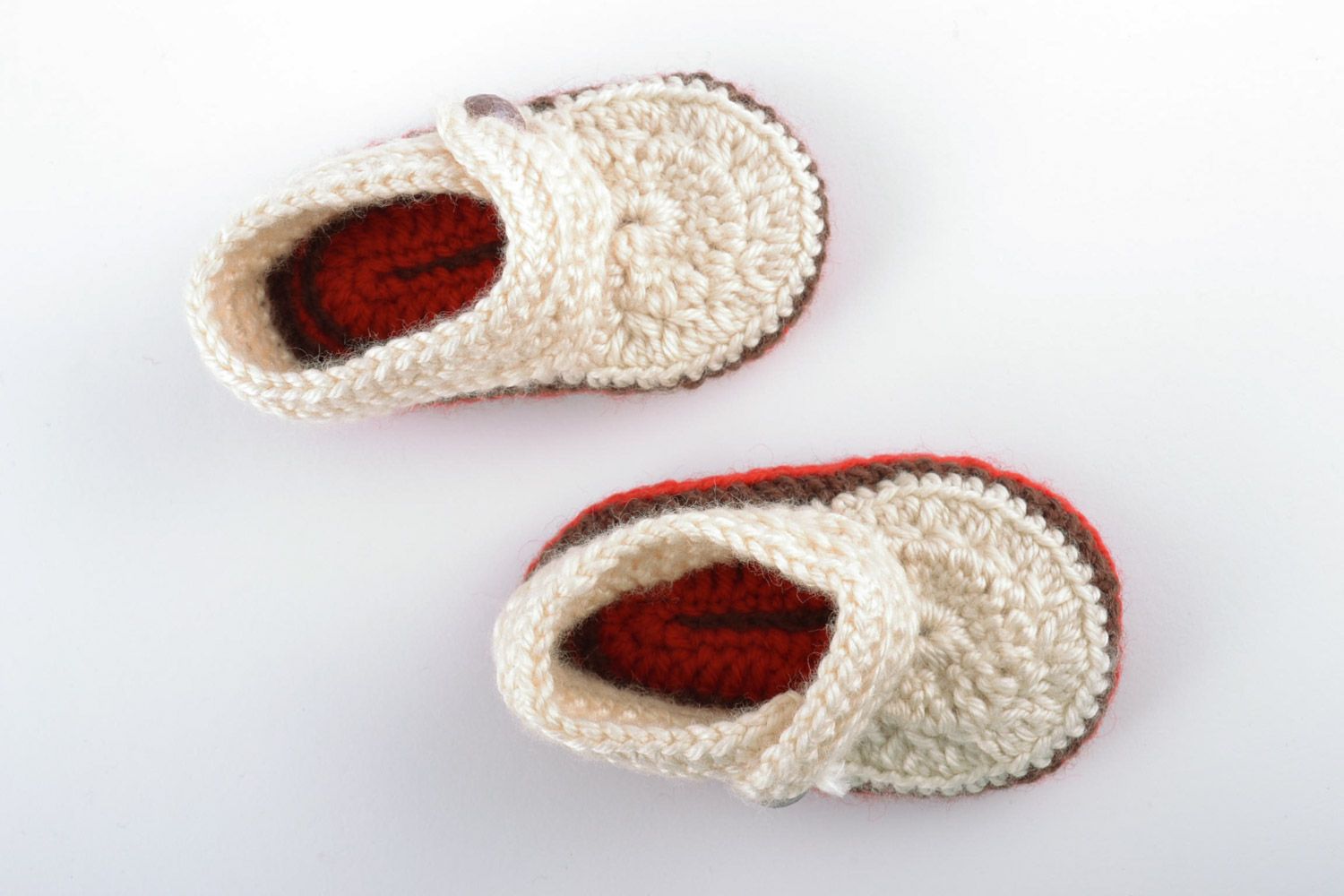 Light handmade knitted wool baby booties with beads and brown outsole photo 3