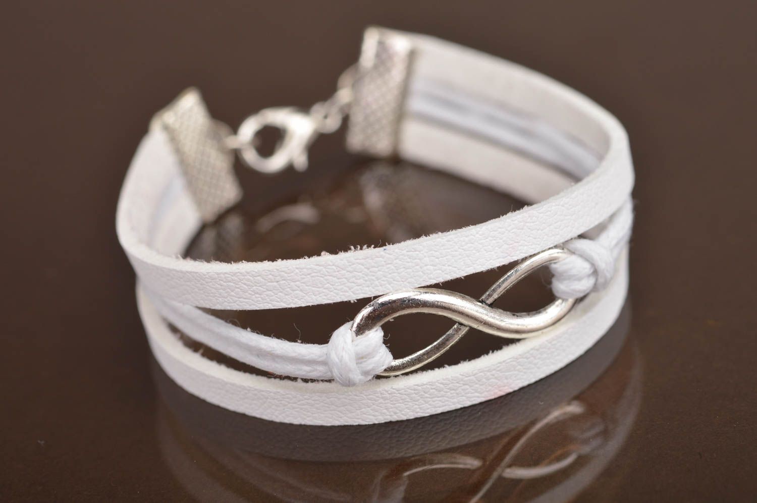 Handmade white laconic genuine leather wrist bracelet with infinity sign insert photo 2