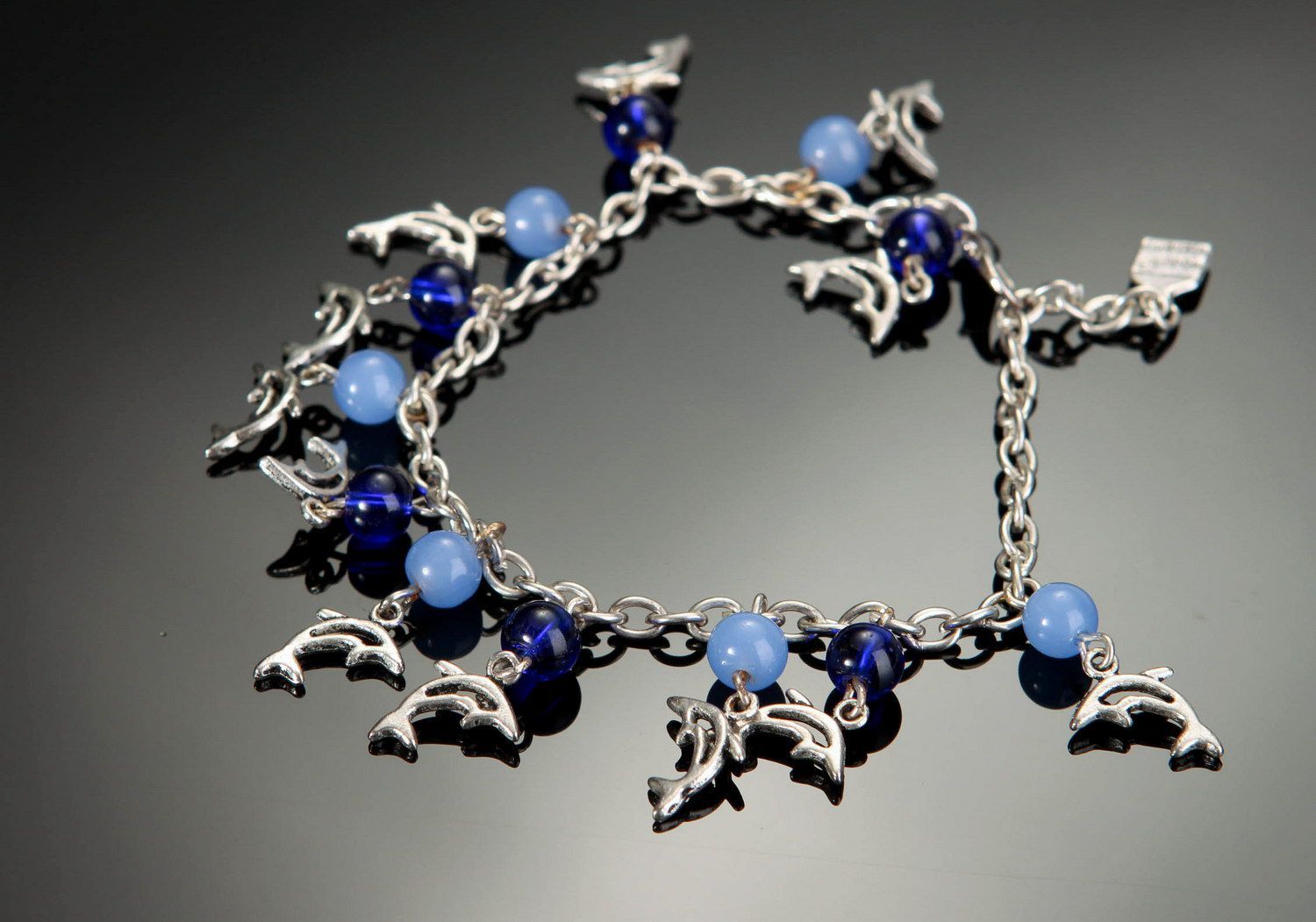 Bracelet avec pendentifs en verre et acier Dauphins  photo 2
