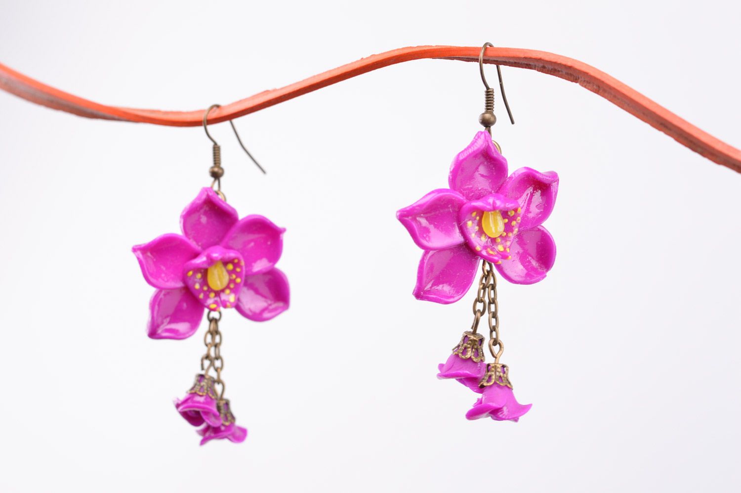 Homemade long plastic flower earrings with charms in the shape of orchids photo 2