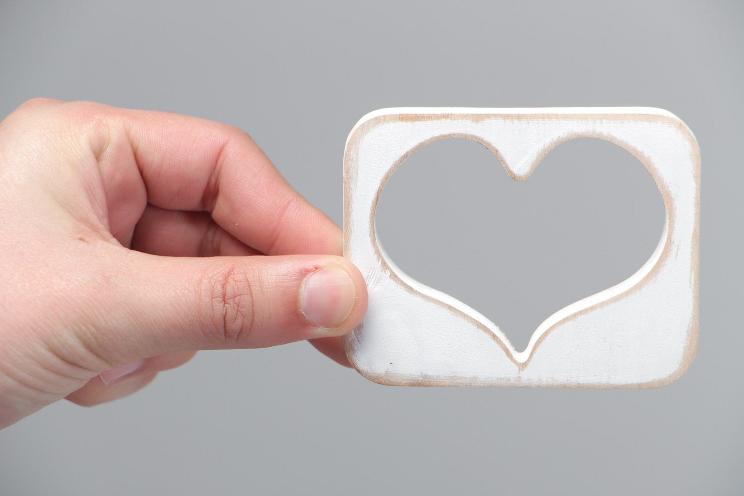 Small handmade plywood table decoration of white color in the shape of heart  photo 5