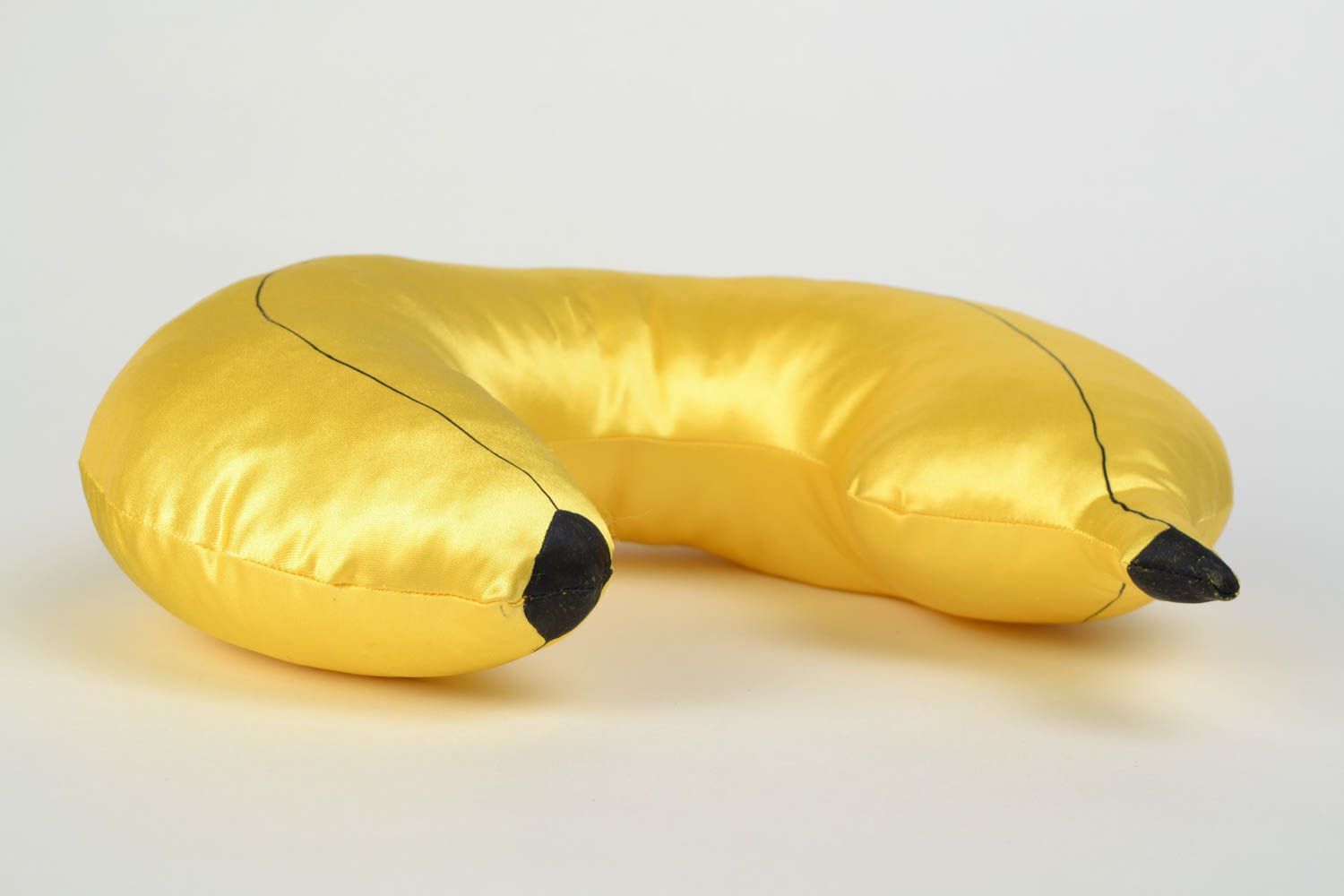 Handmade yellow satin travel pillow in the shape of banana photo 3