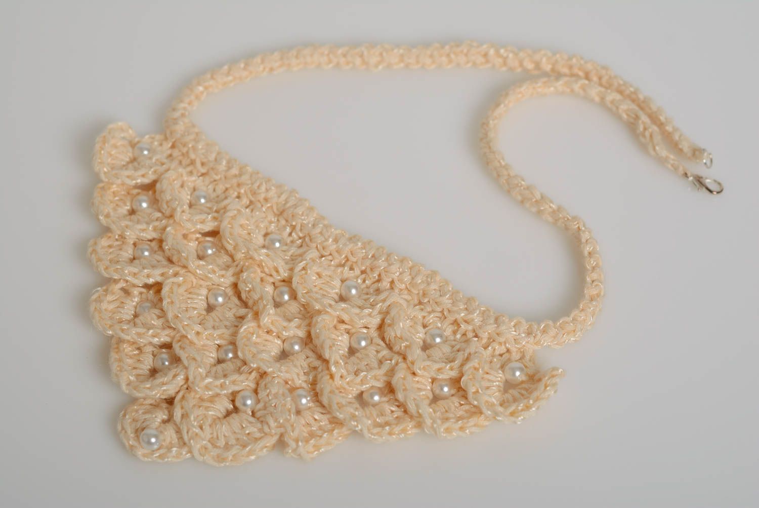 Crocheted handmade necklace made of acrylic yarn white artificial pearl beads  photo 1