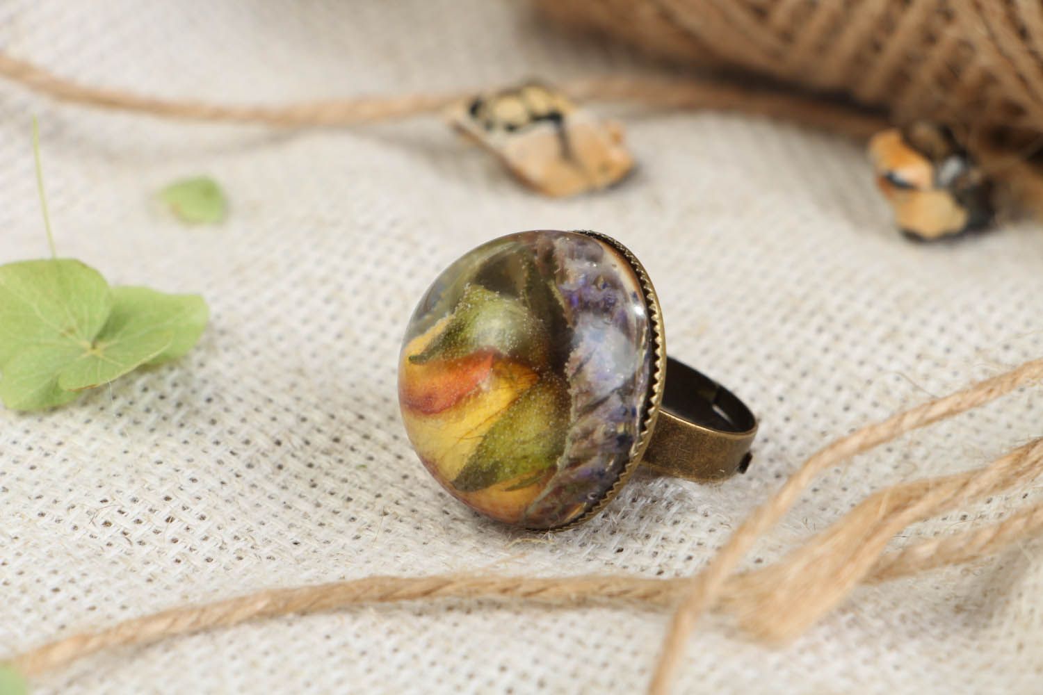 Ring with natural rose coated with jewelry resin photo 1