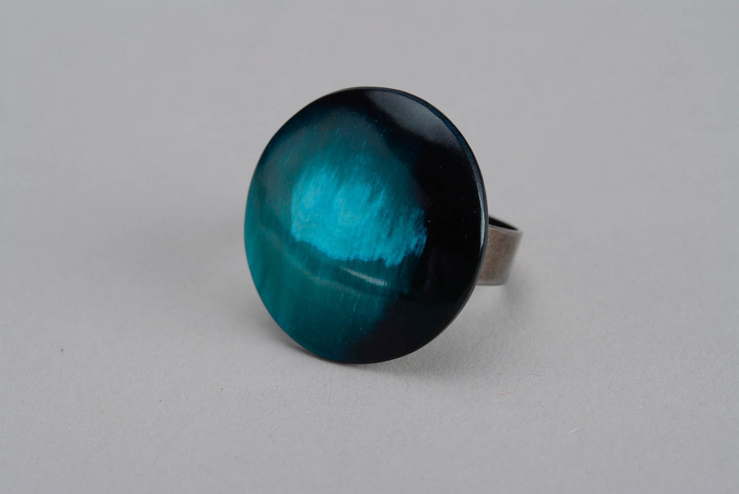 Turquoise ring made of cow horn photo 1