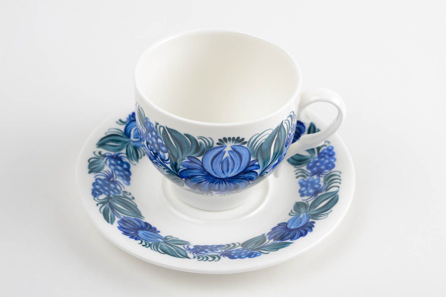 White porcelain cup with handle and saucer with blue floral pattern in Russian style photo 5