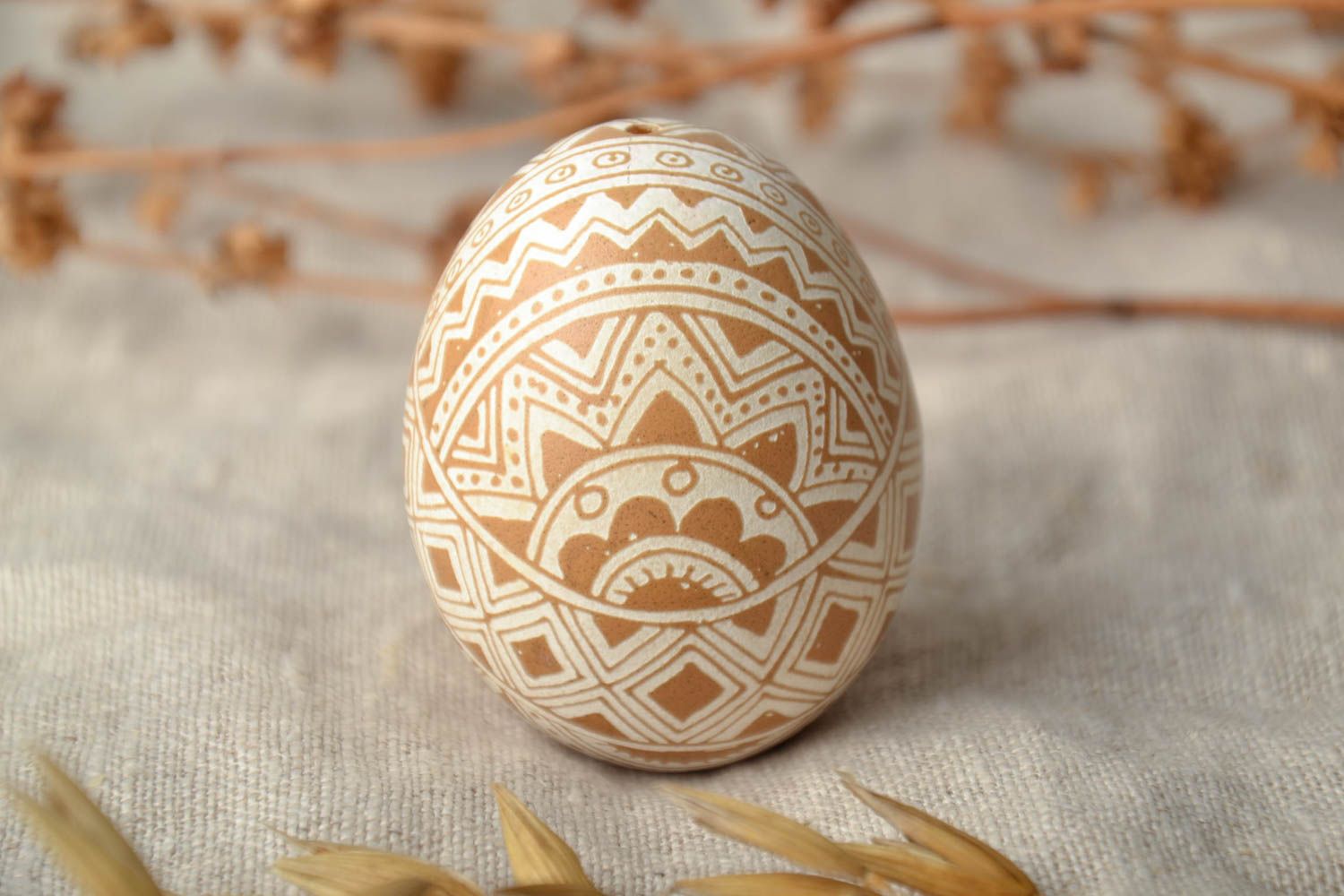 Easter egg with traditional Ukrainian symbolics made using vinegar etching technique photo 1