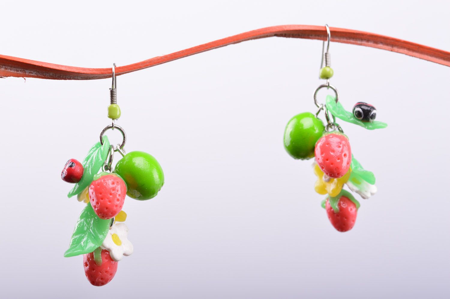 Handmade designer polymer clay long earrings with charms in the shape of berries photo 2