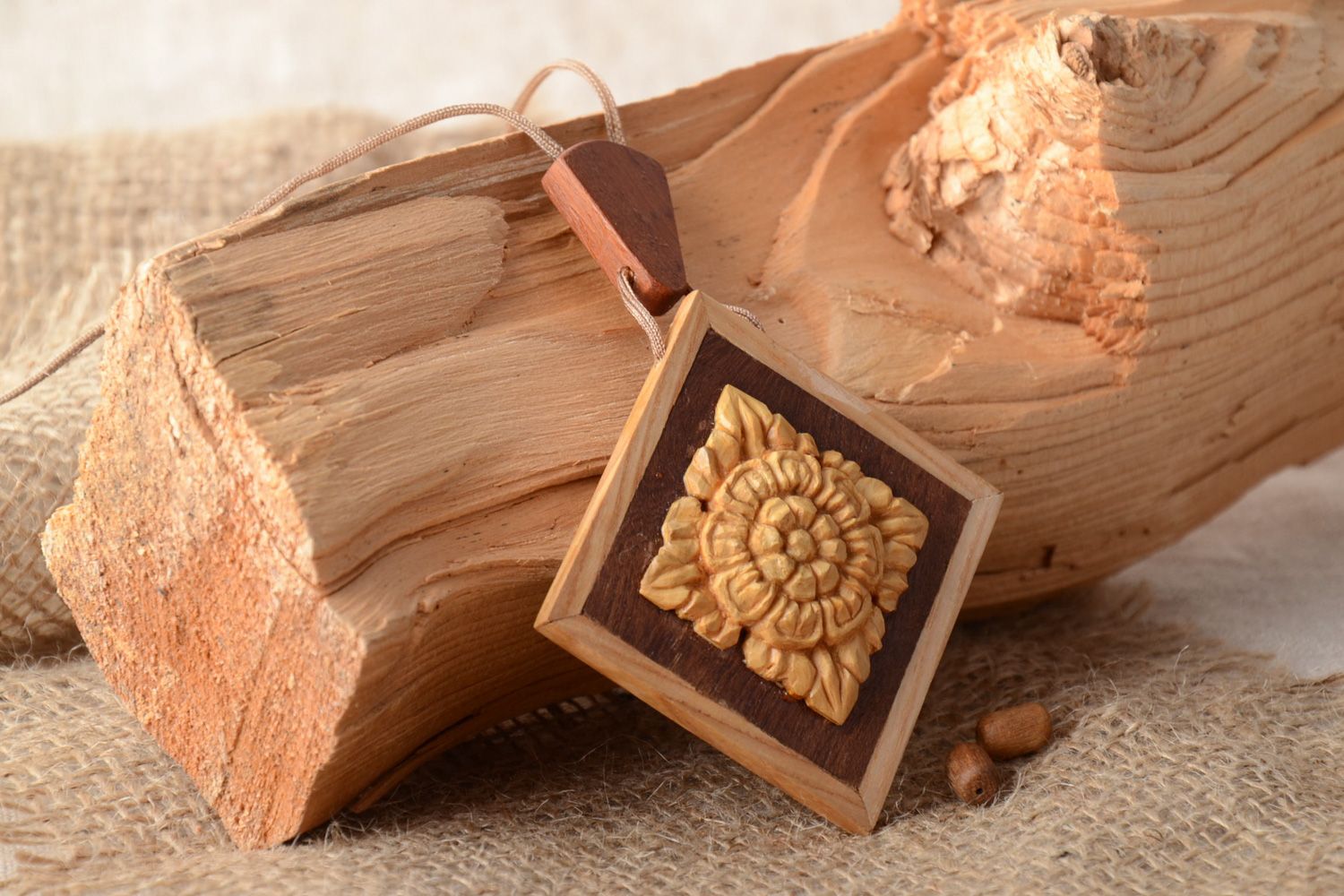 Handmade carved wooden neck pendant with intarsia equipped with cord for women photo 1
