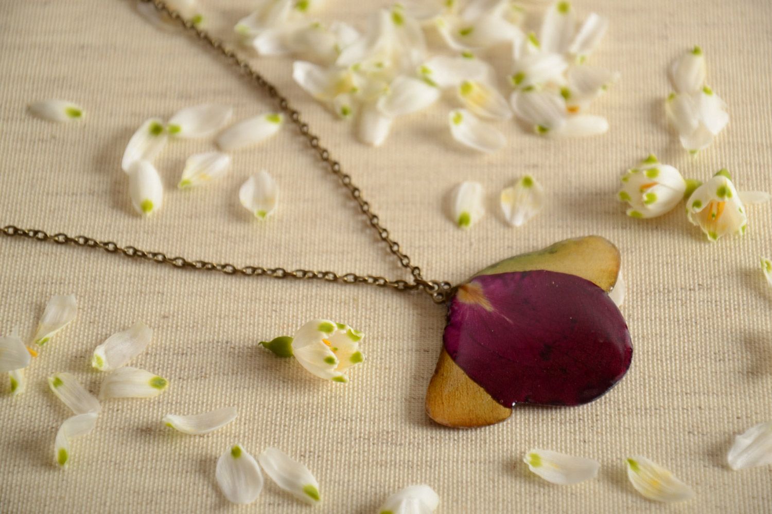 Handmade neck pendant on long chain with flower petals coated with epoxy photo 1