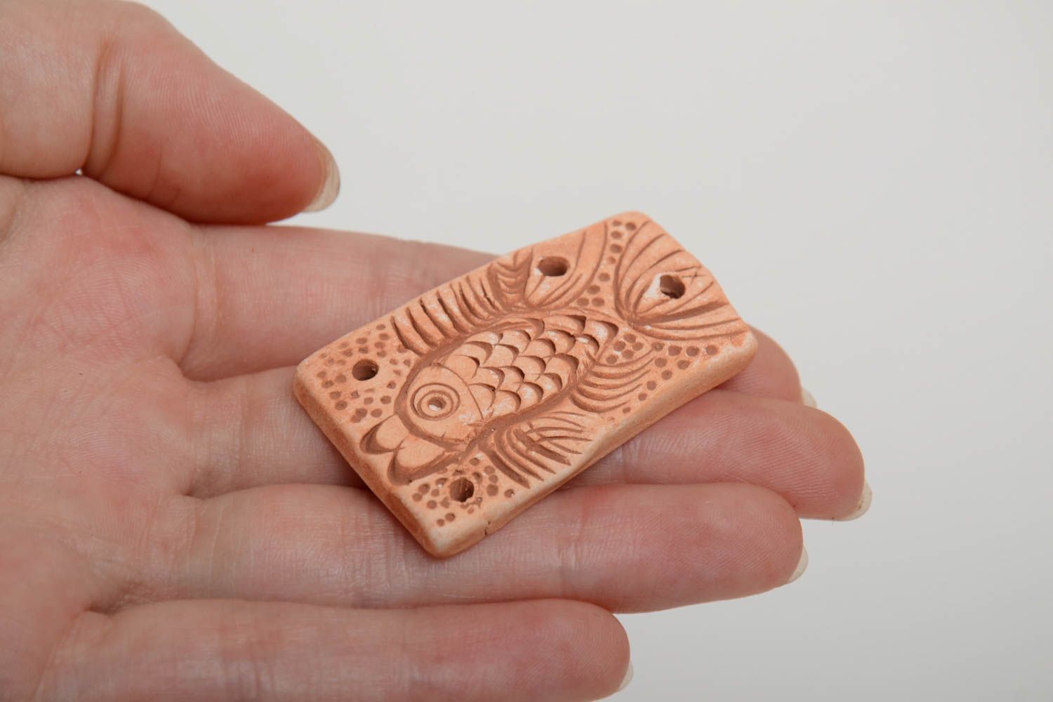 Handmade rectangular unpainted flat ceramic pendant with embossed fish pattern  photo 5