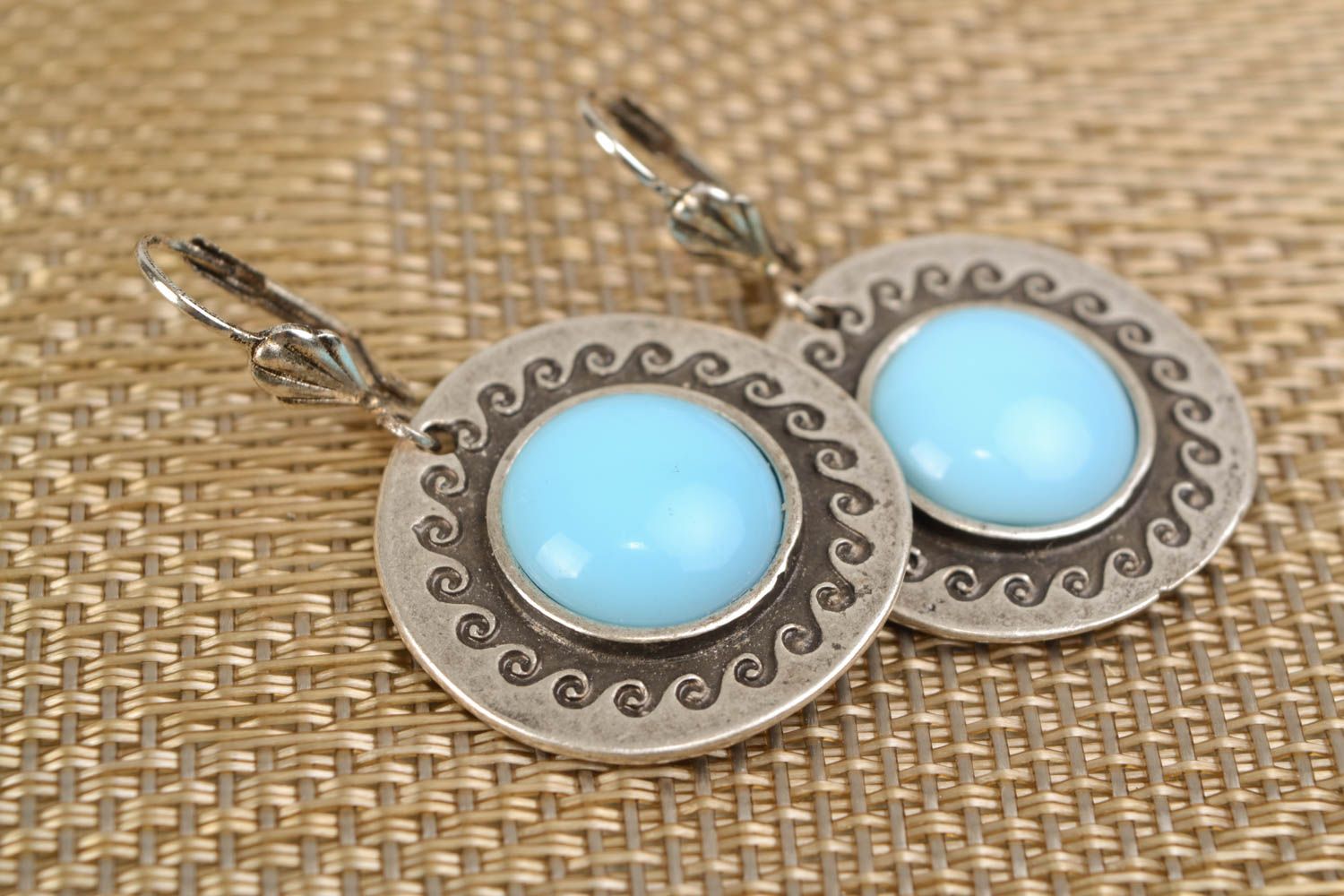 Round metal earrings with blue cabochons photo 1