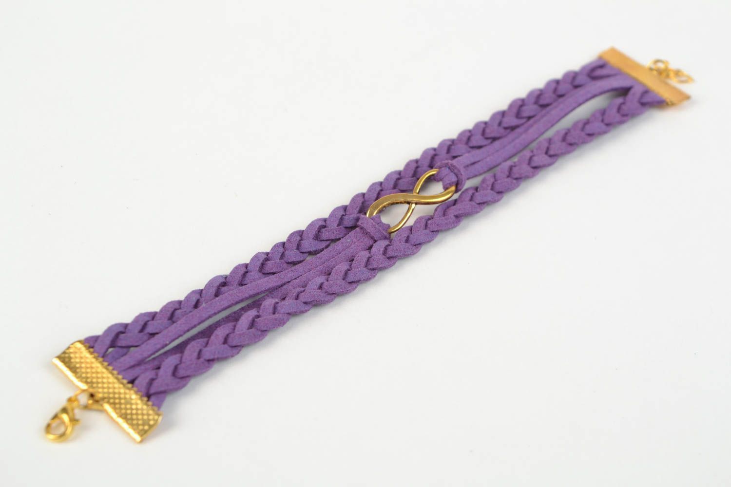 Браслет из замшевого шнура с подвеской бесконечность ручной работы плетеный фиолетовый фото 5