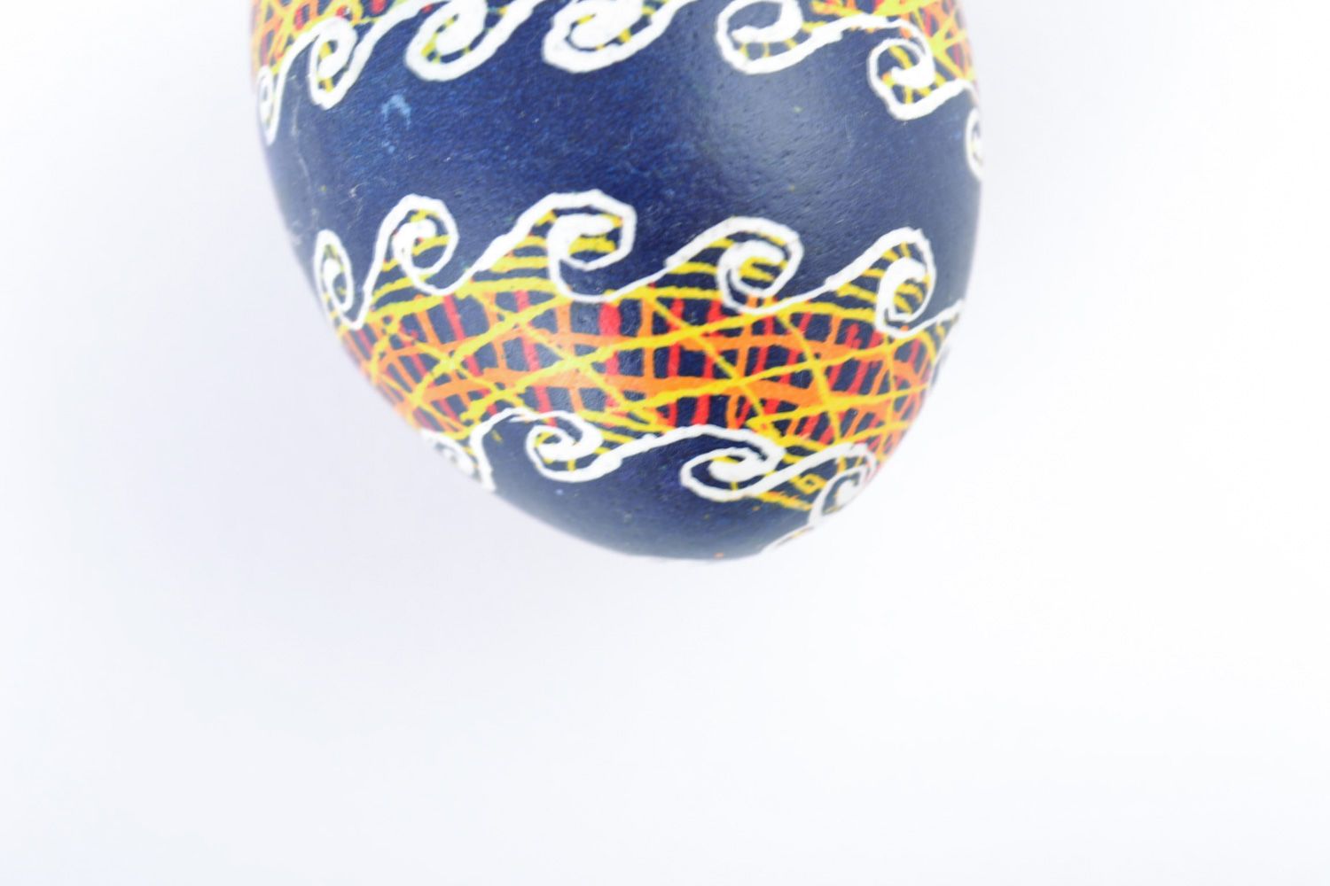 Handmade decorative Easter egg painted with acrylics on blue background photo 4
