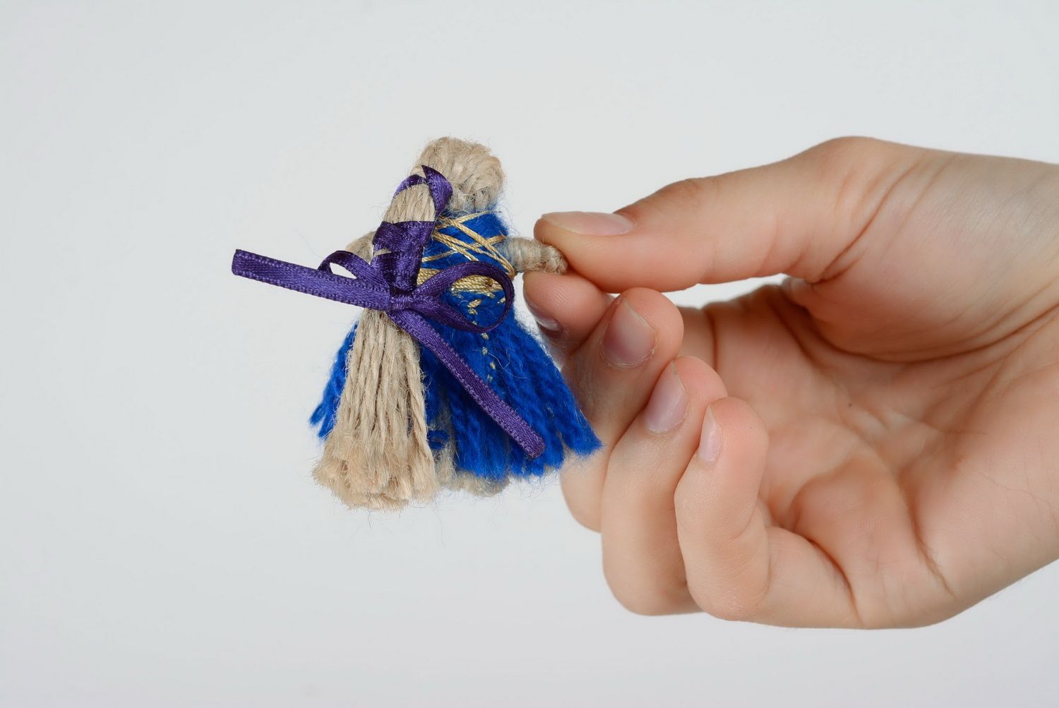 Muñeca de trapo de souvenir de cordón natural foto 2