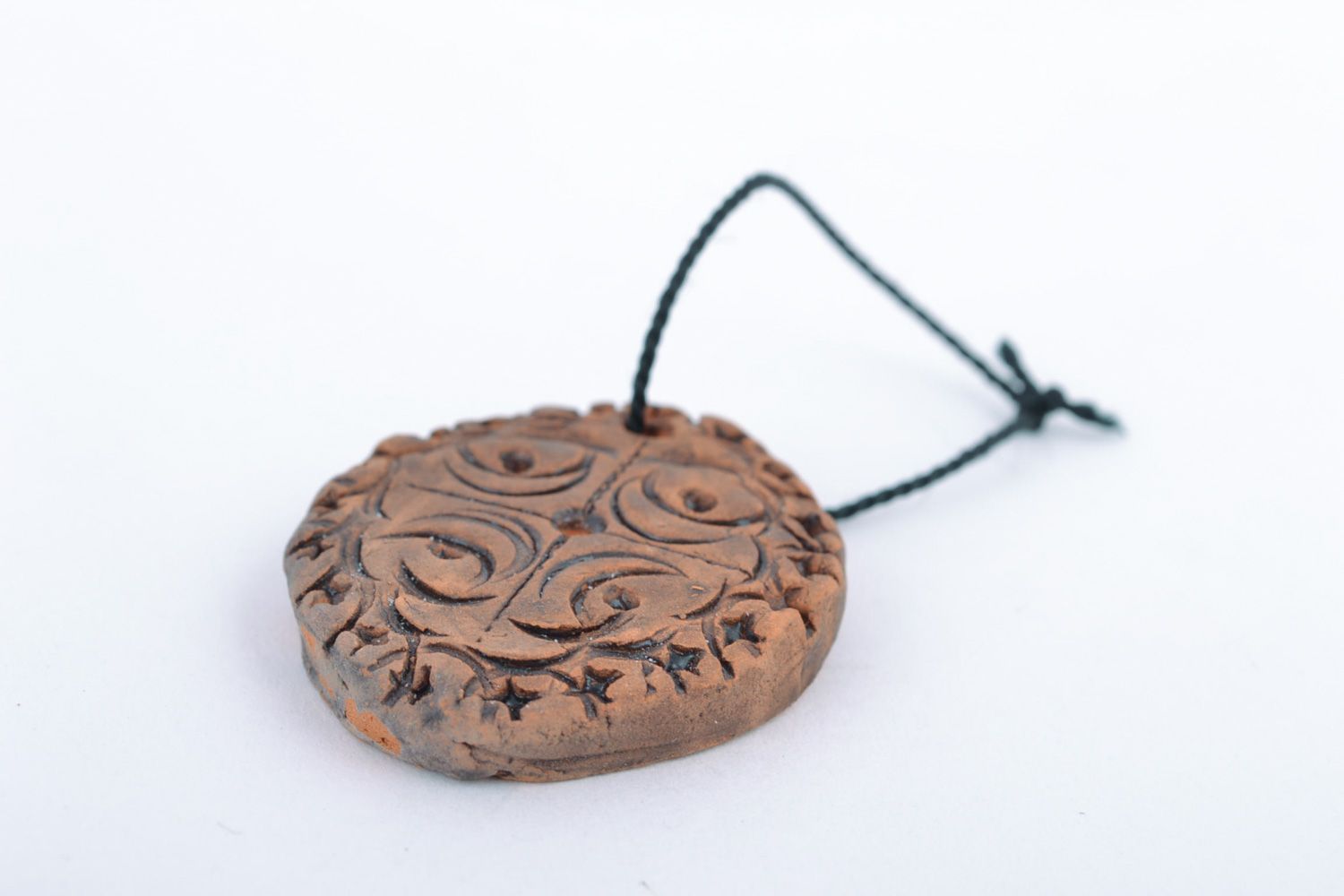 Small handmade ceramic wall hanging with embossed ornament in ethnic style photo 5