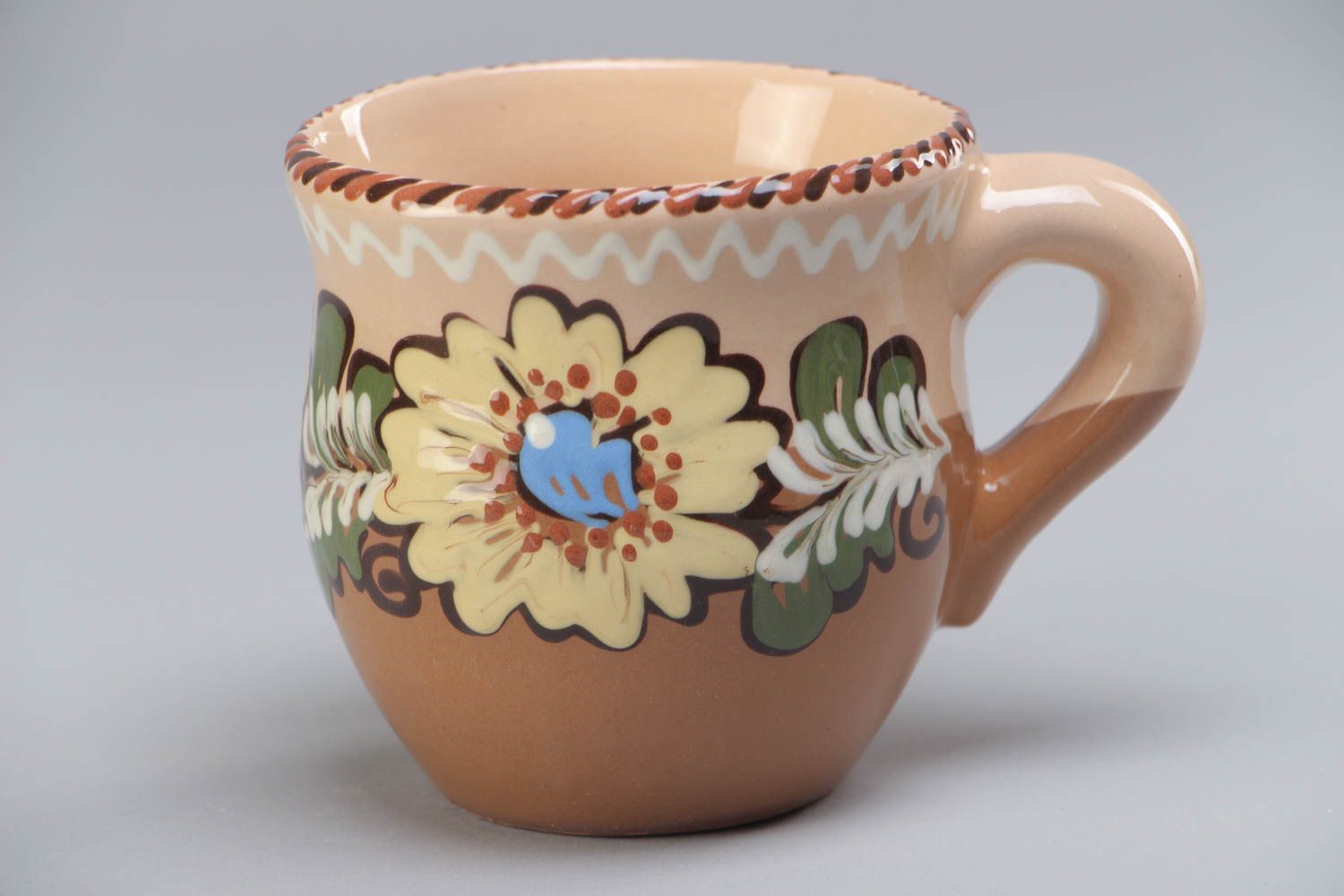 10 oz clay glazed cup with handle and floral design in brown, beige, and blue color photo 2