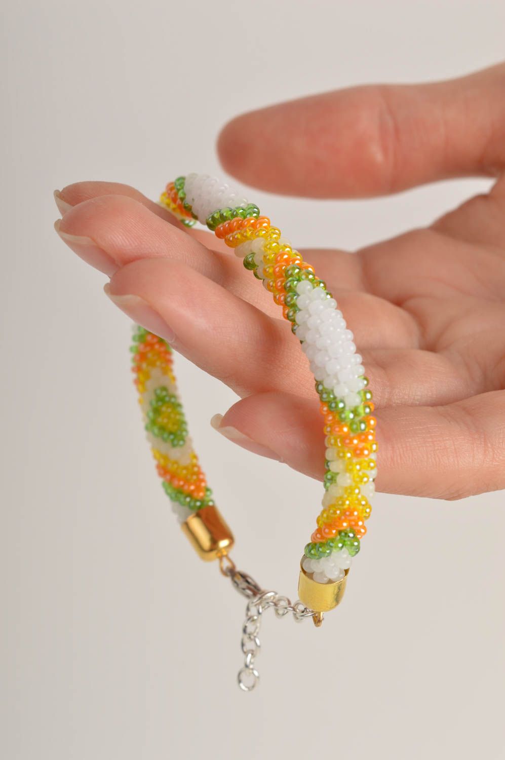 Beaded cord adjustable bracelet in light green, yellow and white color photo 5