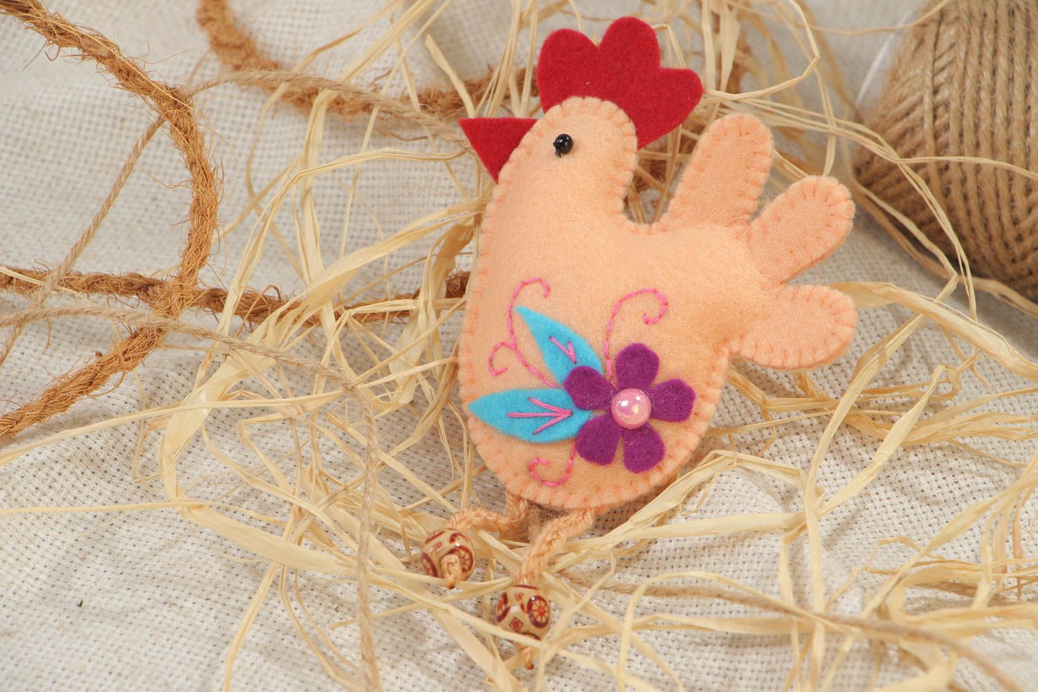 Handmade soft toy fridge magnet in the shape of felt cockerel with thread paws photo 1
