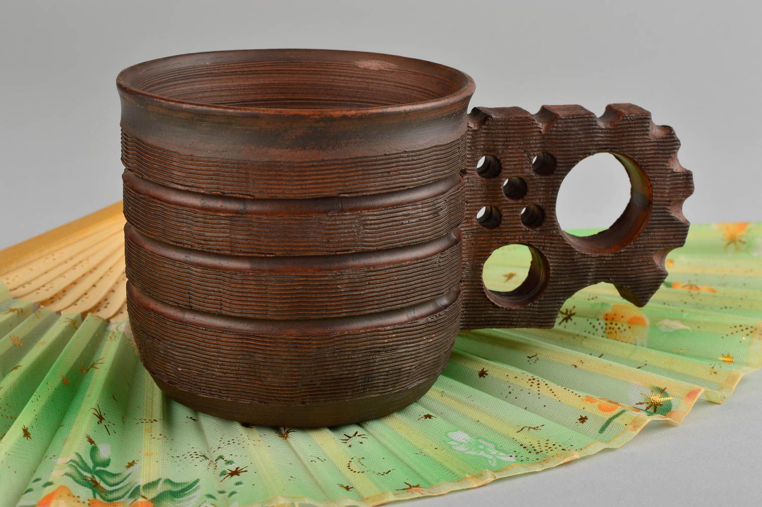 Clay cup for drinks with large handle in dark brown color photo 1