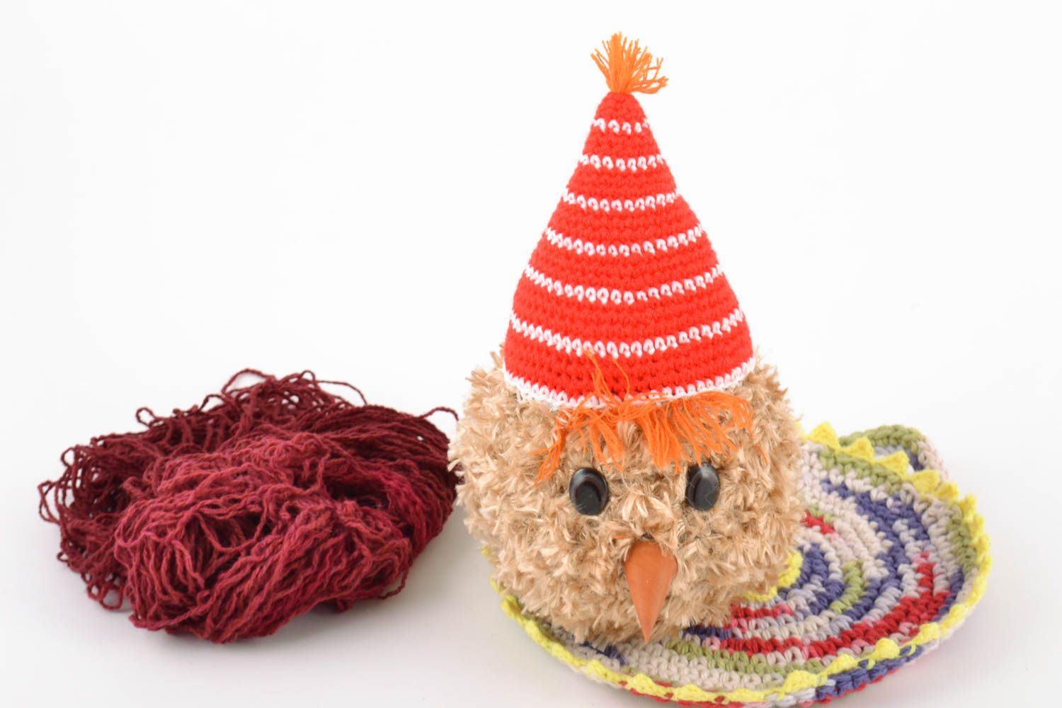 Nice children's handmade crochet soft toy fluffy in party cap photo 1