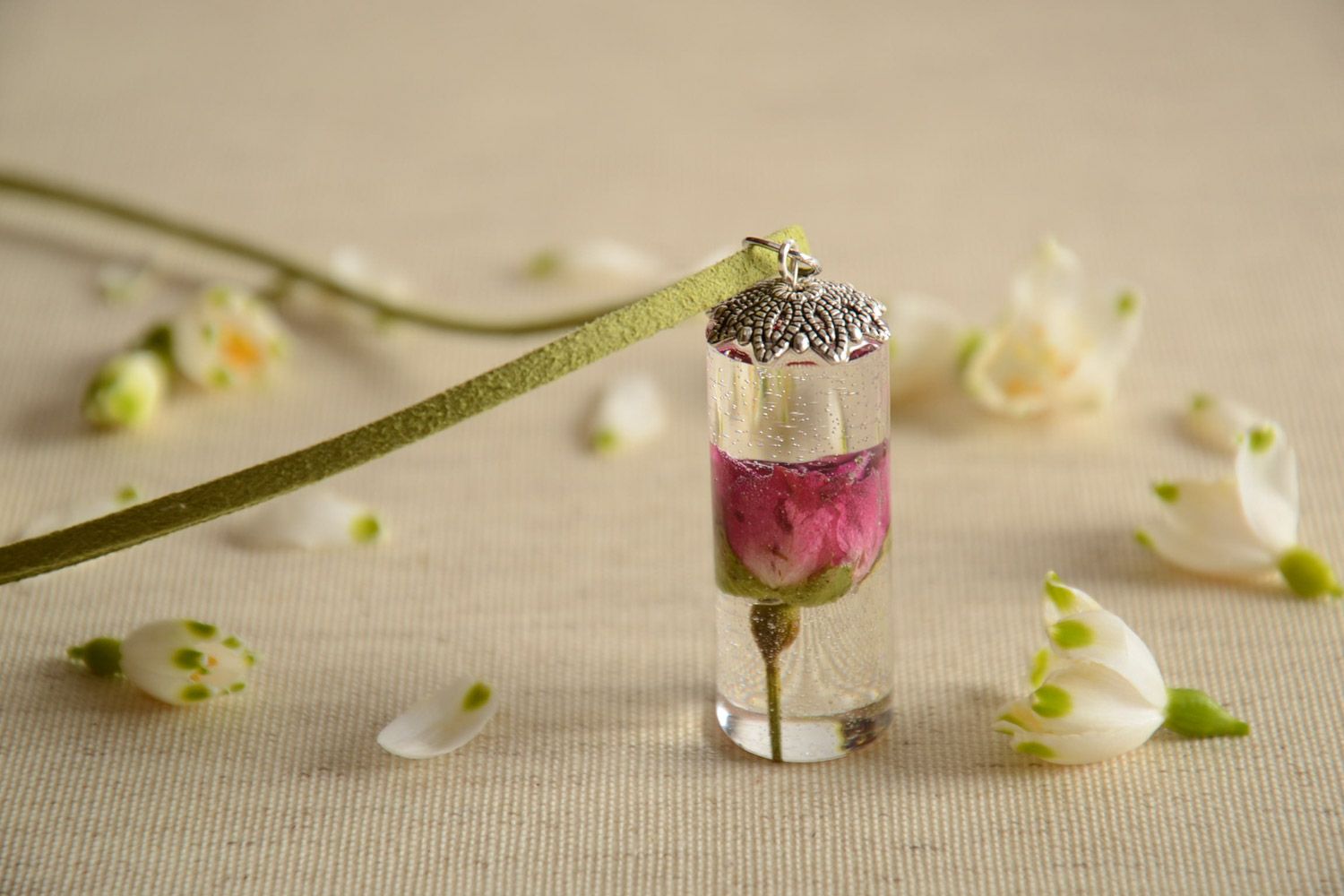 Handmade neck pendant on suede cord with real flower coated with epoxy in the shape of cylinder photo 1