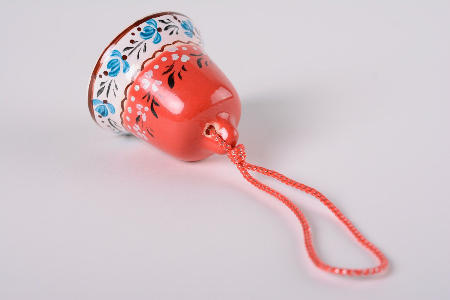 Small handmade maiolica ceramics decorative glazed red bell with blue ornament photo 5