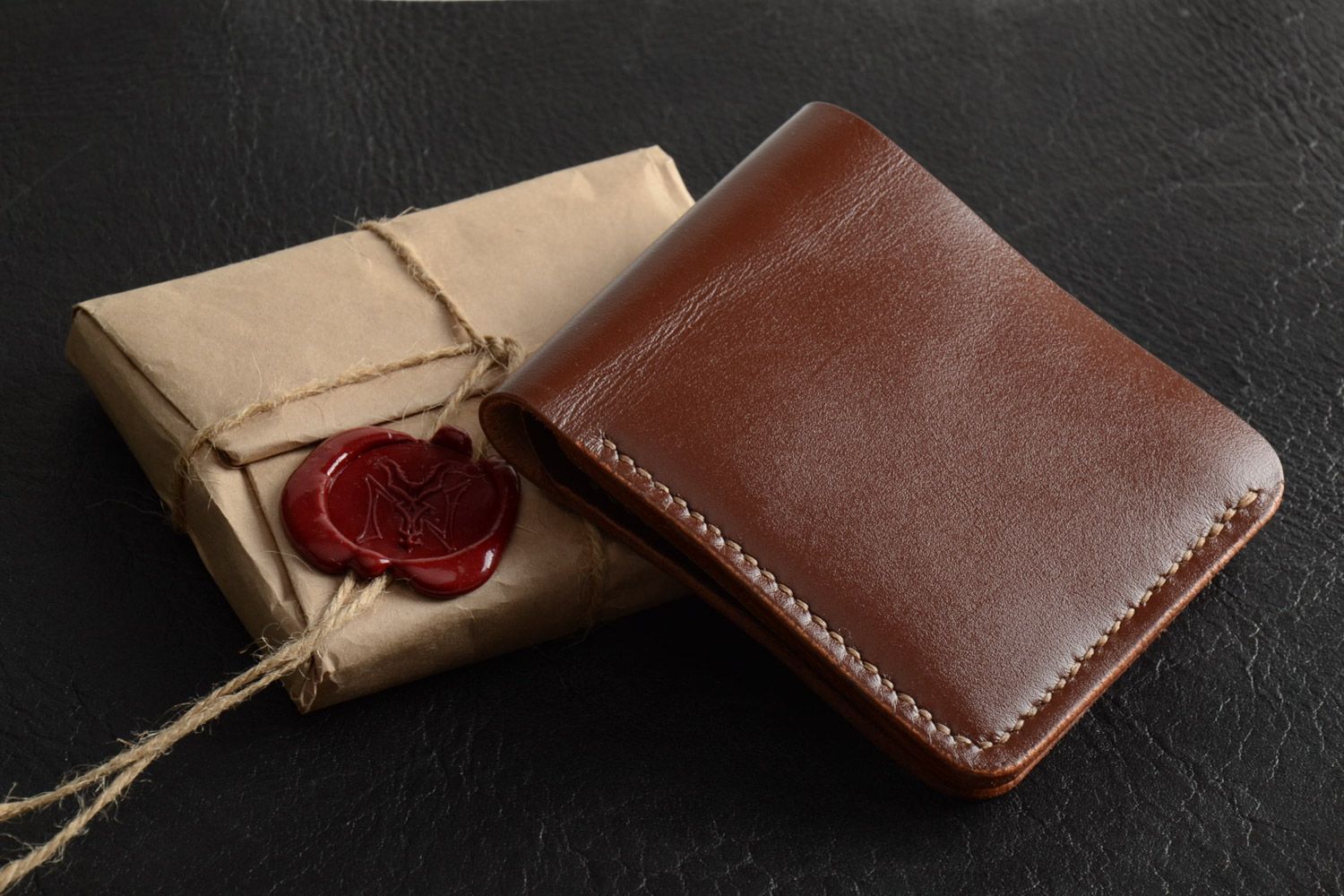 Handmade genuine leather wallet of brown color with three departments for men photo 1