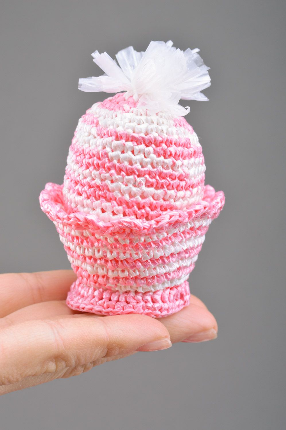 Handmade decorative Easter egg crocheted of pink threads on stand and cover photo 3