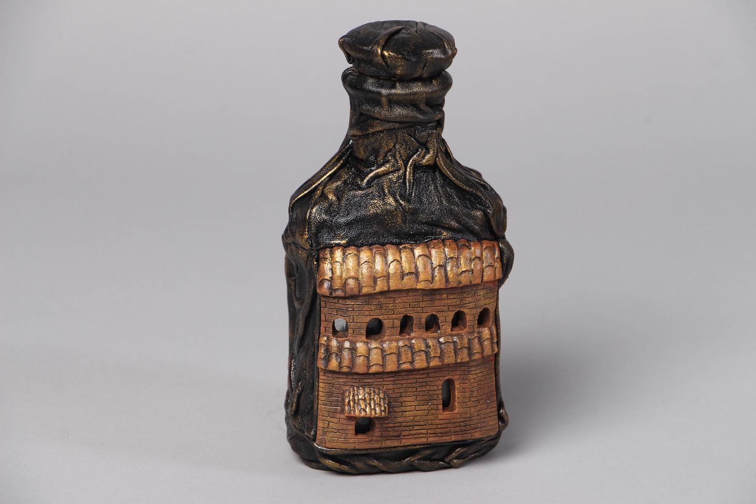 Handmade decorative bottle with leather and clay photo 1