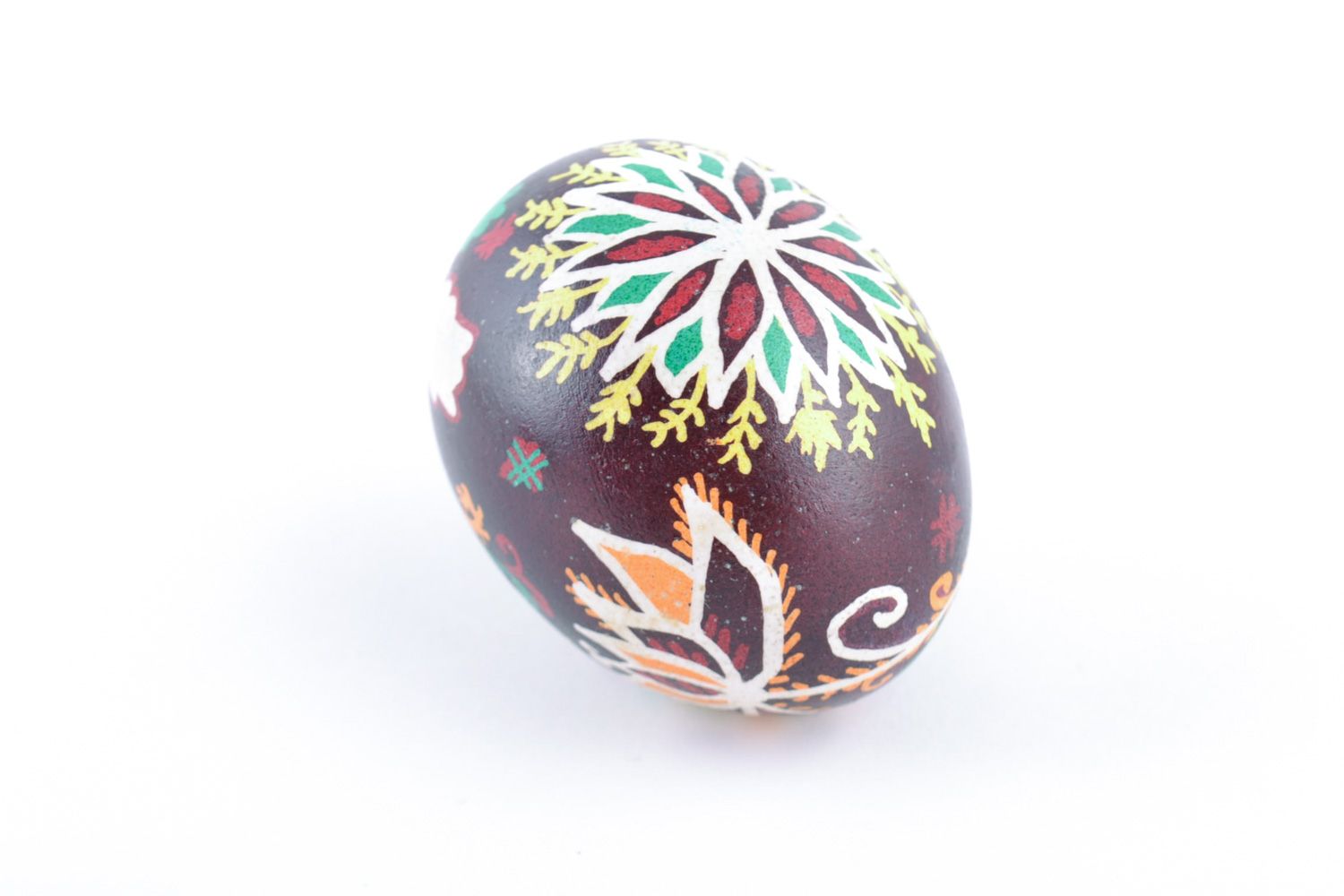 Handmade designer painted Easter egg with floral ornaments on dark background photo 3