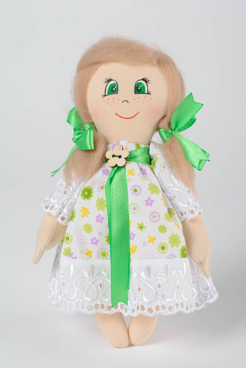 Handmade cotton fabric soft doll girl in floral dress with green ribbons photo 1
