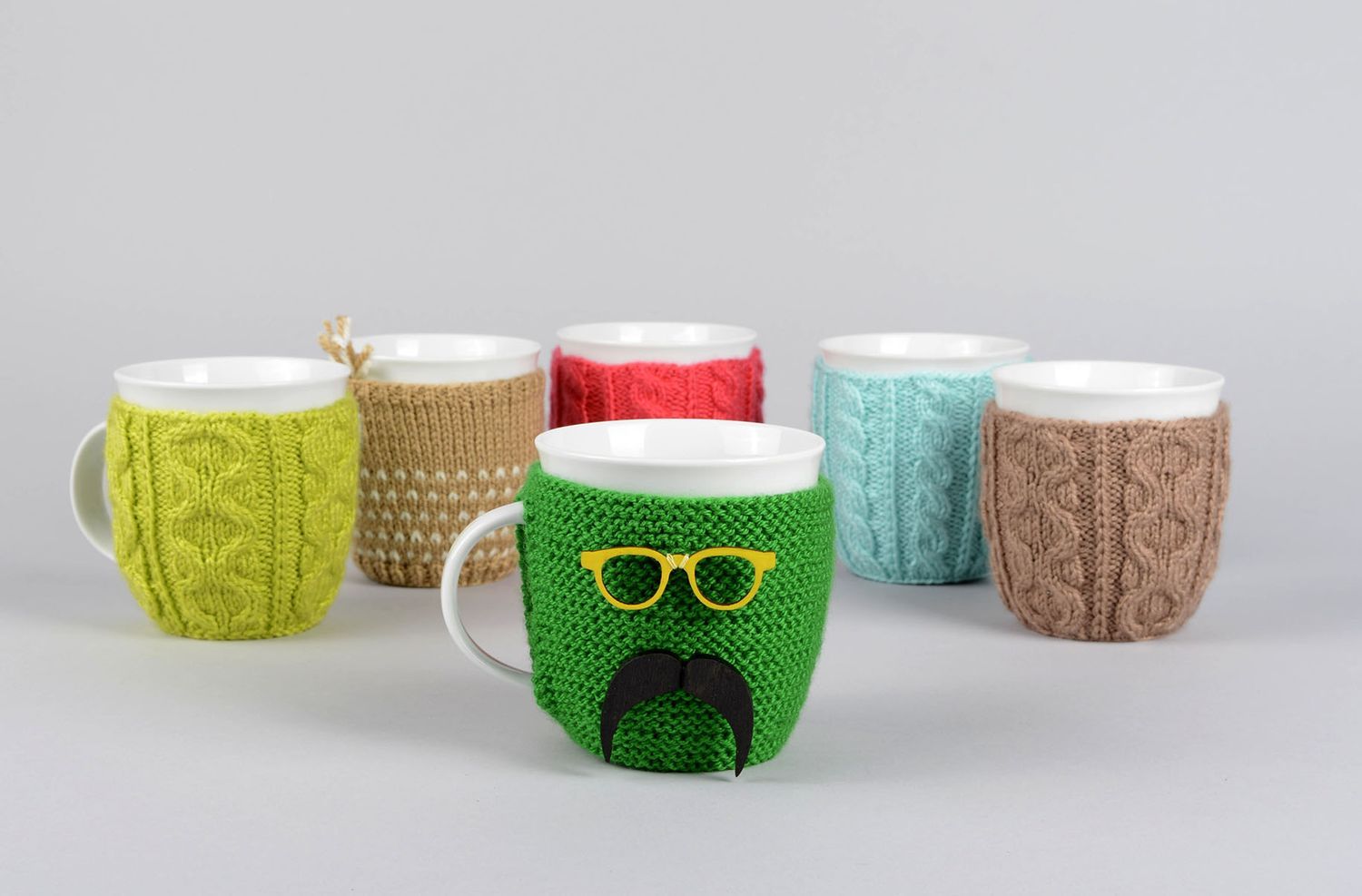 White ceramic porcelain teacup with handle and green man with mustache knitted cover photo 5