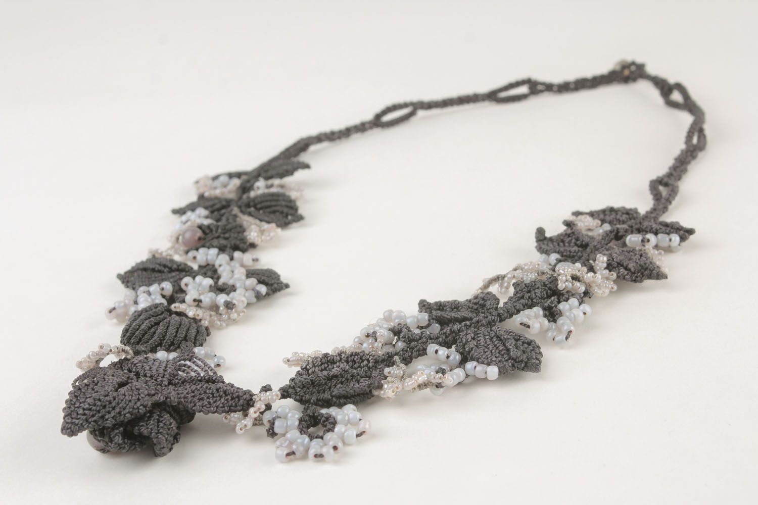 Necklace made of threads and beads photo 5