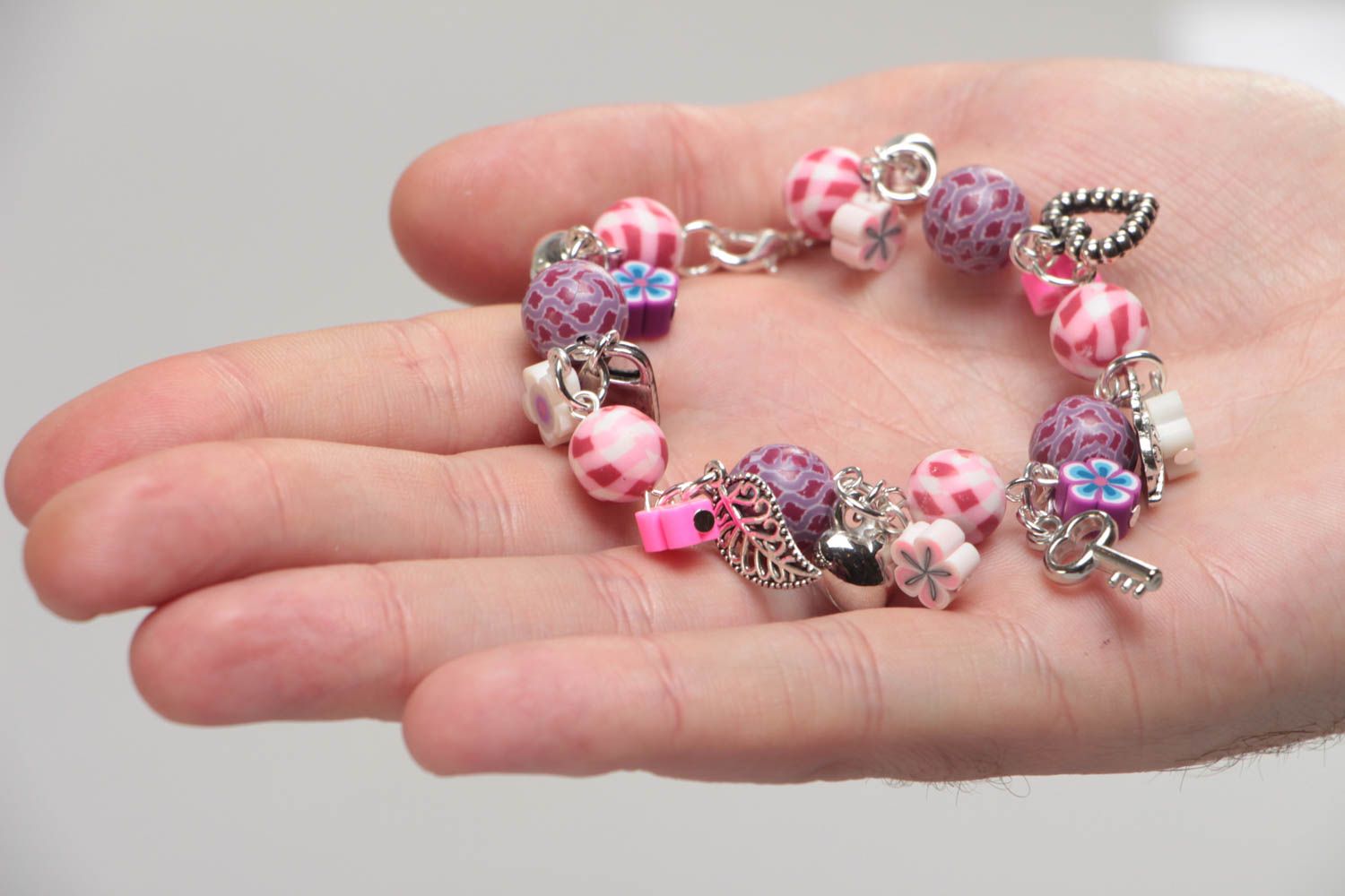 Handmade pink children's polymer clay wrist bracelet with charms photo 5