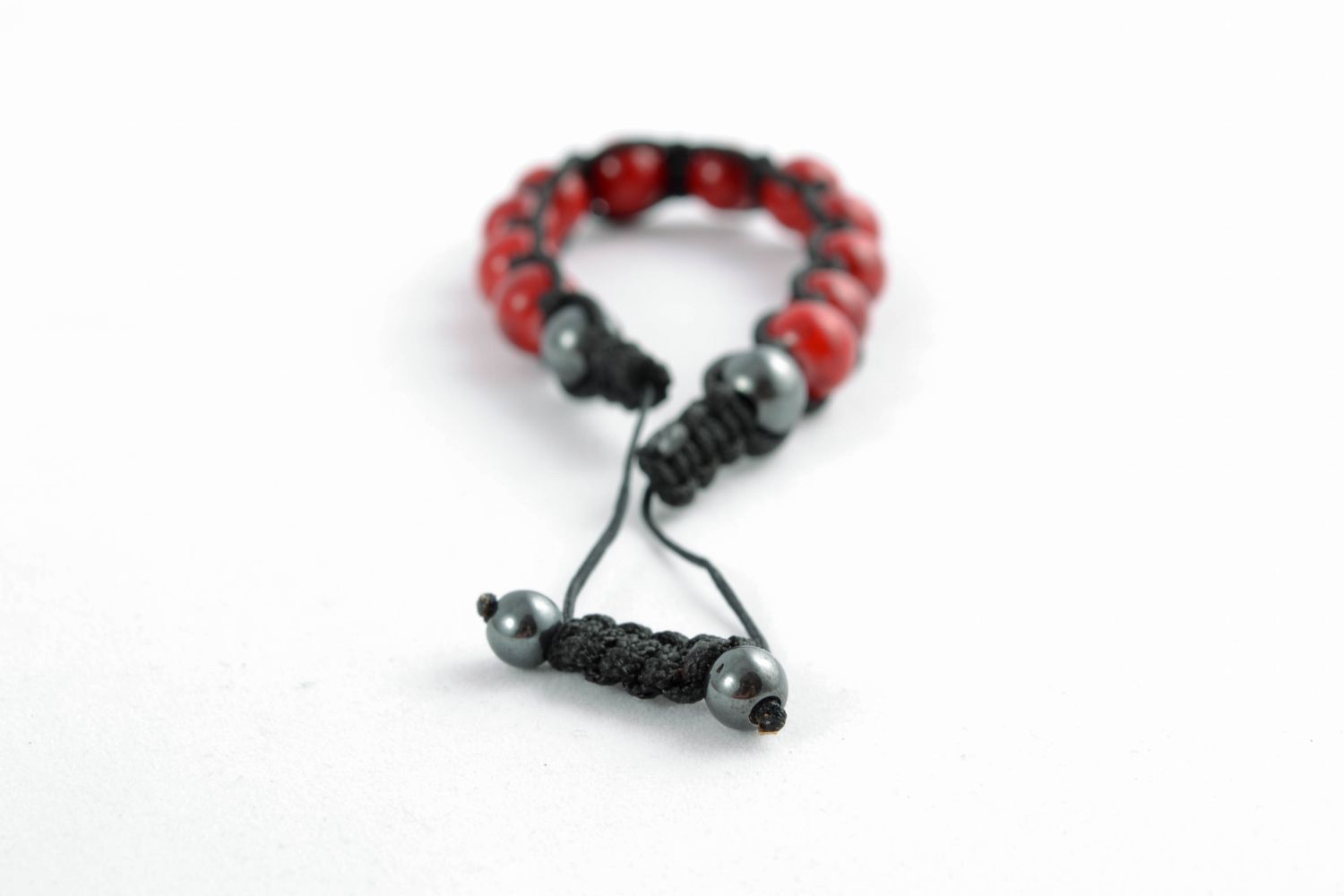 Cord bracelet with red beads photo 2