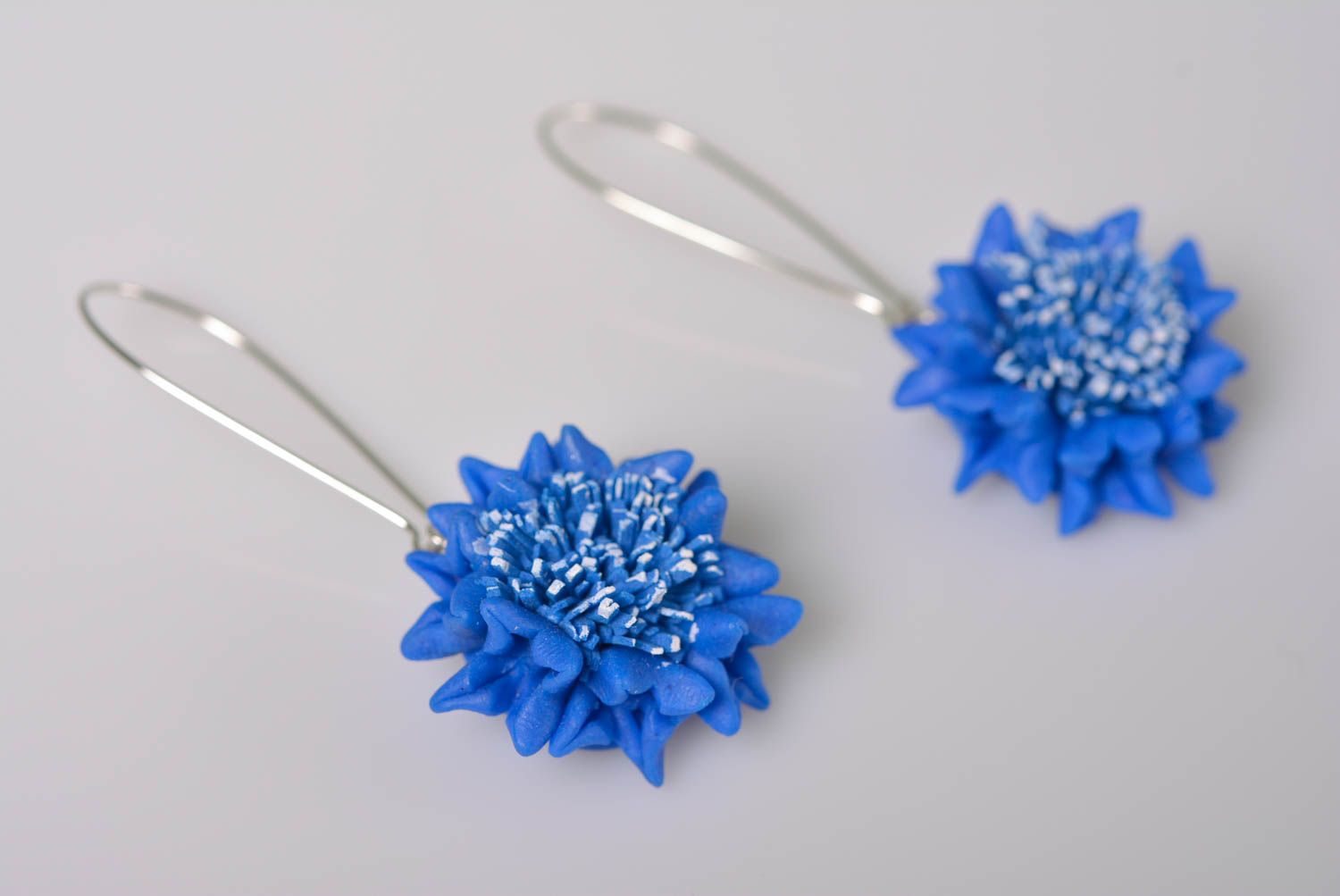 Handmade designer earrings with polymer clay blue cornflowers on metal basis photo 1