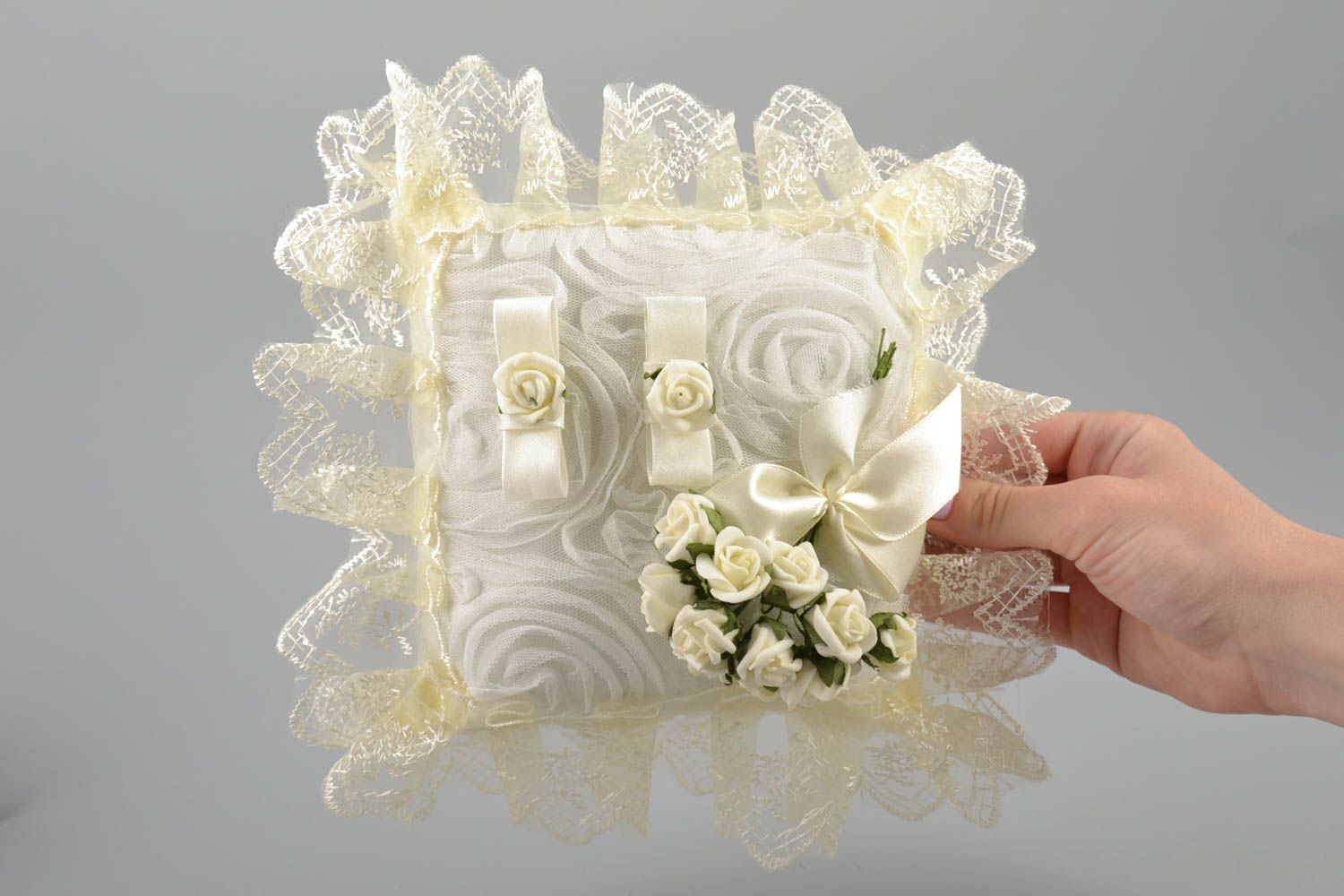 Handmade decorative fabric ring pillow with cream lace and artificial flowers photo 5