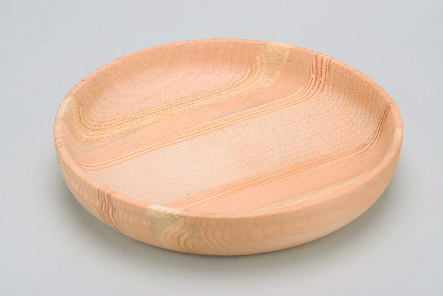 Plato de madera para los productos secos foto 1