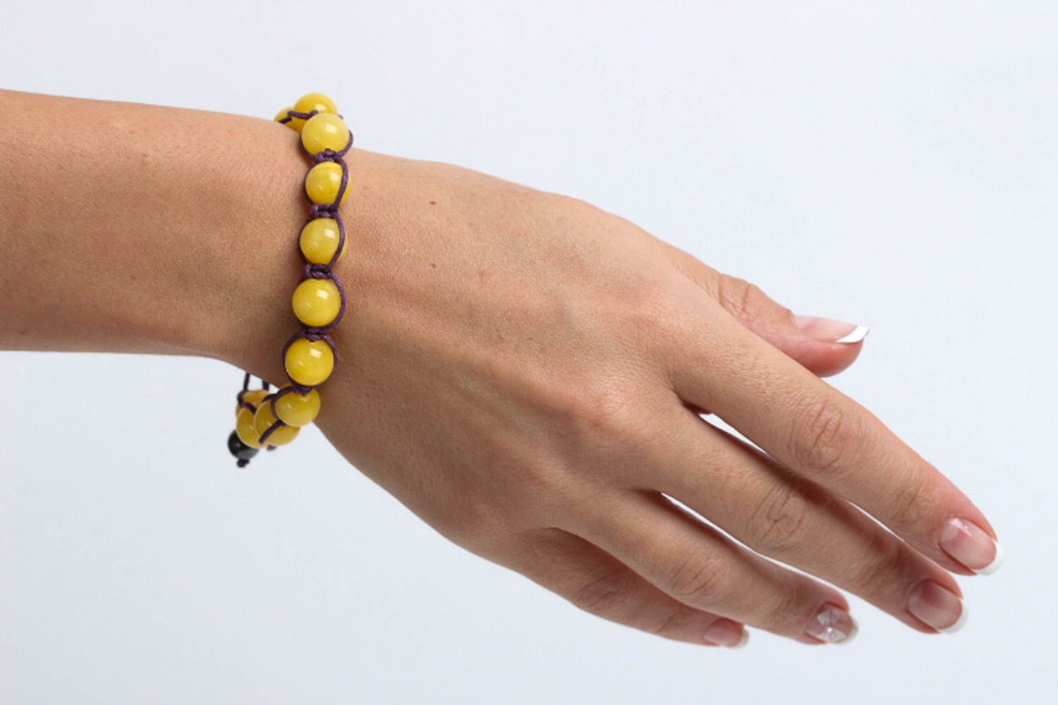 Yellow hematite and calcite beads strand bracelet on black cord  photo 5