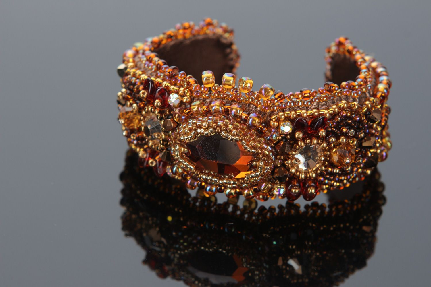 Handmade brown sparkling wrist bracelet embroidered with beads and crystals photo 1