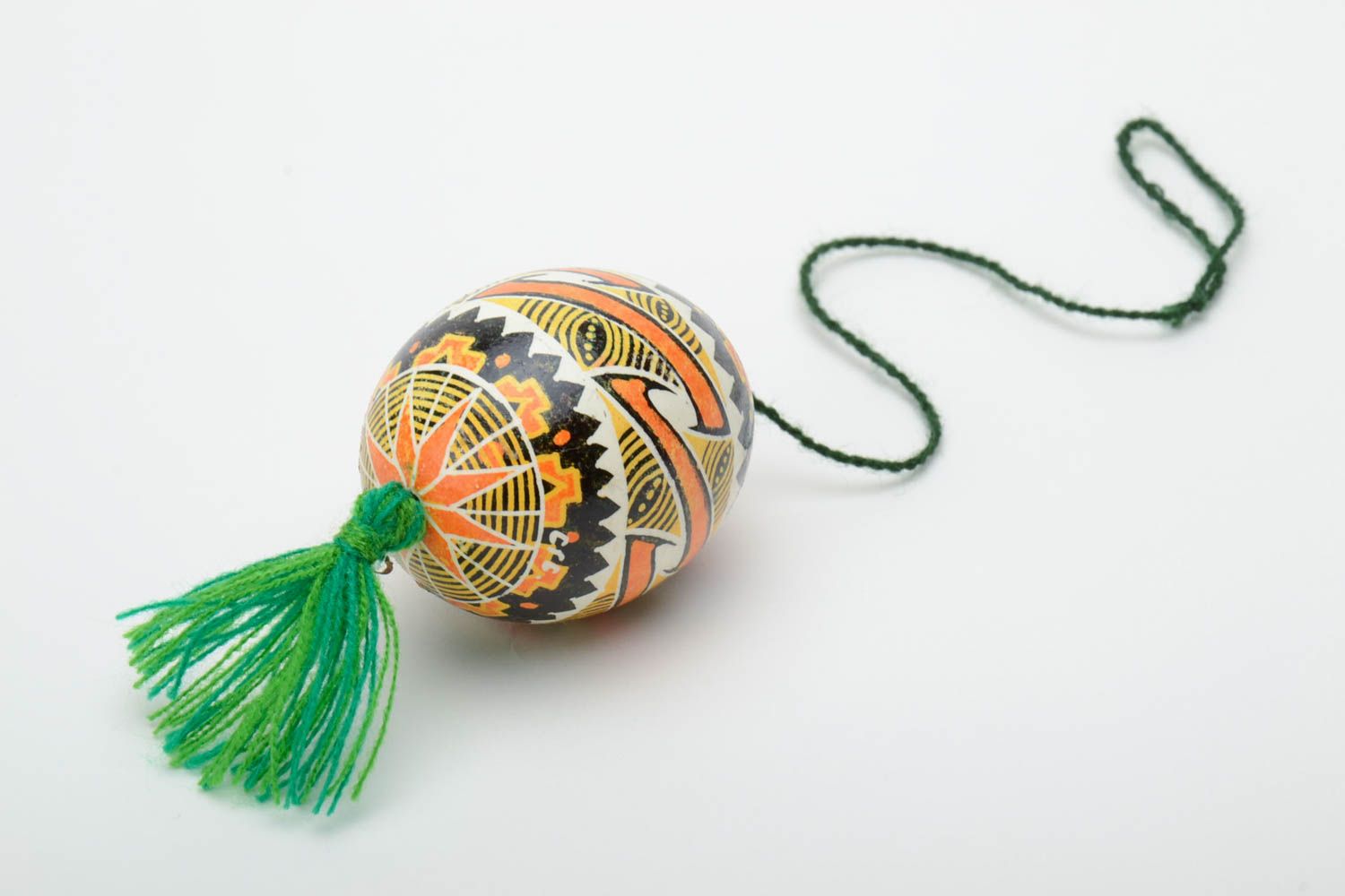Handmade traditional wax painted colorful Easter egg with green tassel photo 4