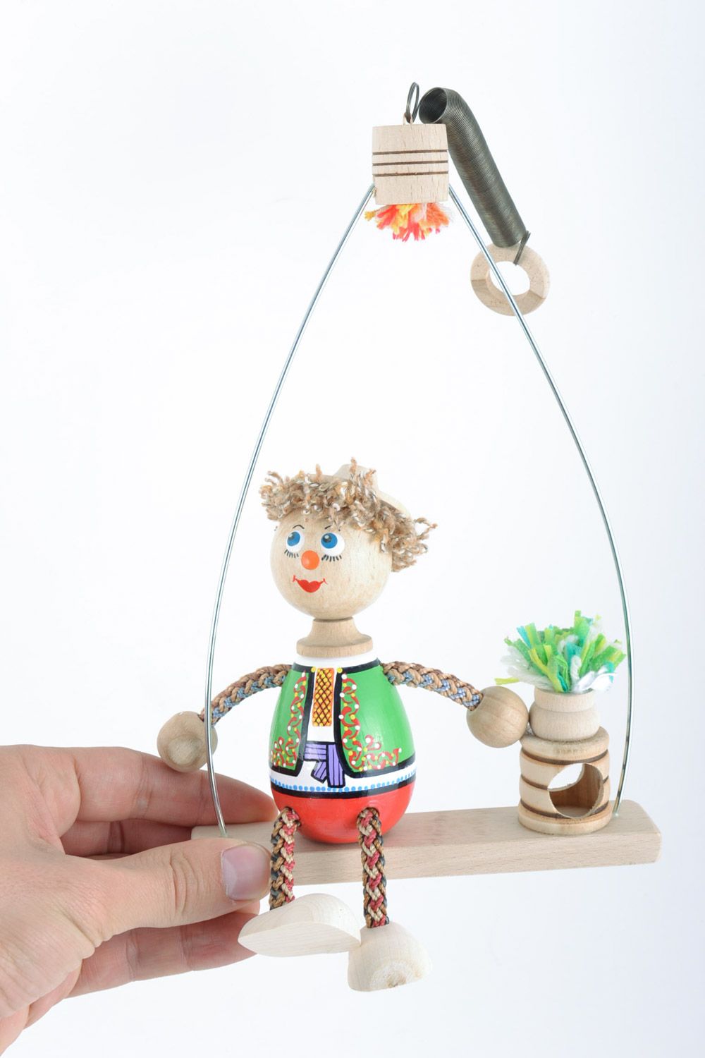 Handmade painted wooden eco toy boy in Ukrainian costume on swing for kids photo 2