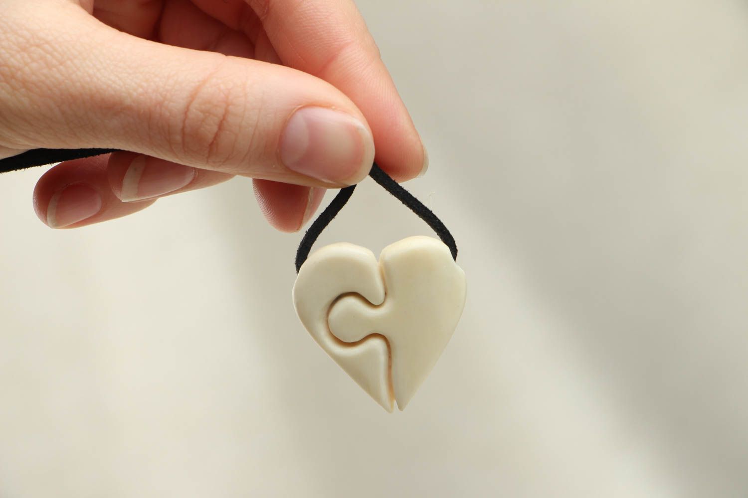 Heart shaped pendant carved of cow bone photo 3
