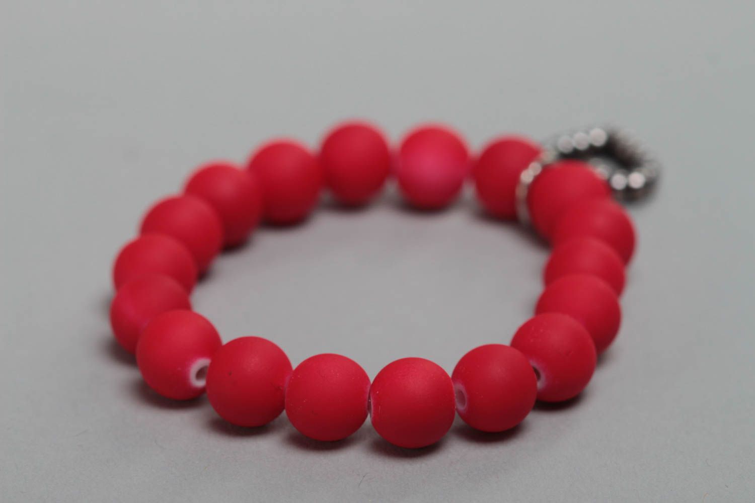 Red handmade children's wrist bracelet with plastic beads and heart charm photo 3