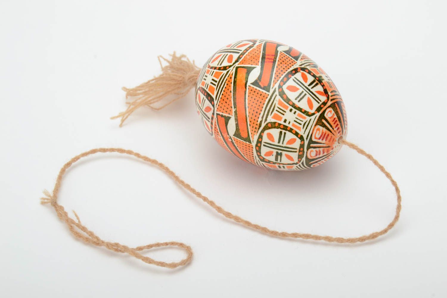 Handmade decorative Easter egg painted in brown color palette with beige tassel photo 2